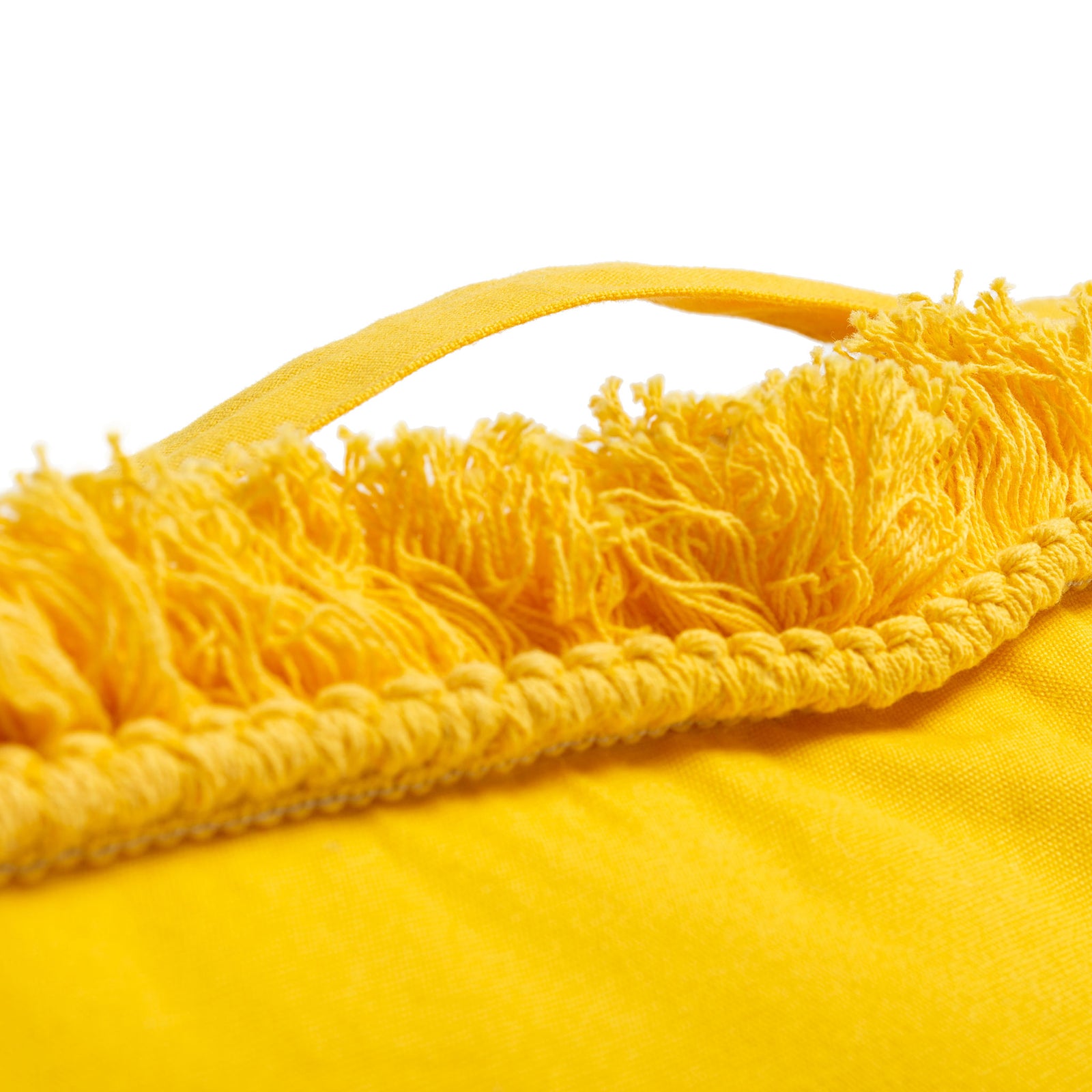 A matching yellow handle arches above thick fringed trim on this colorful floor cushion. || FLP1018B || handle_studio