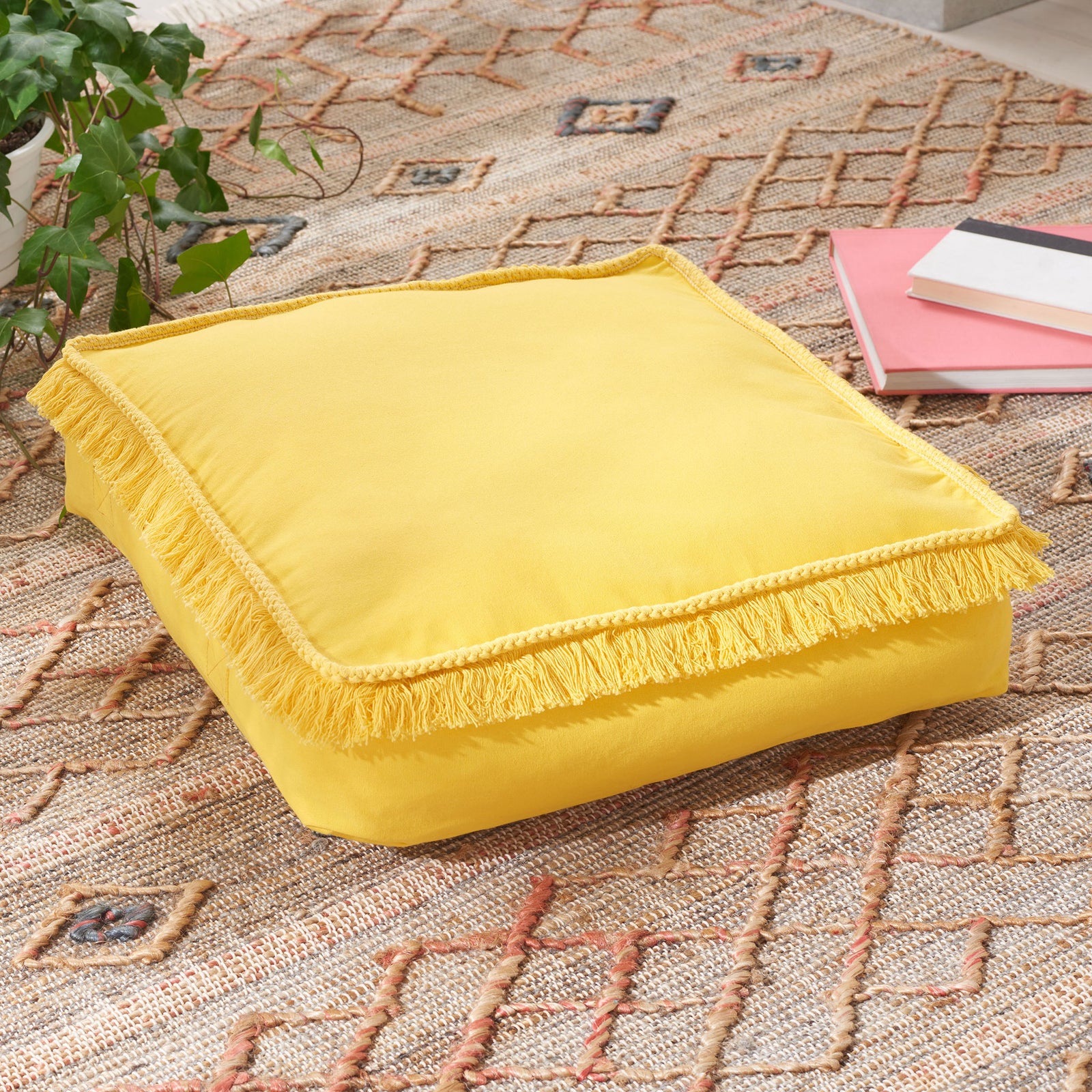 Sunny yellow fabric and full fringe make this plump floor pillow a cheerful spot to lounge. || FLP1018B || front_angle_room