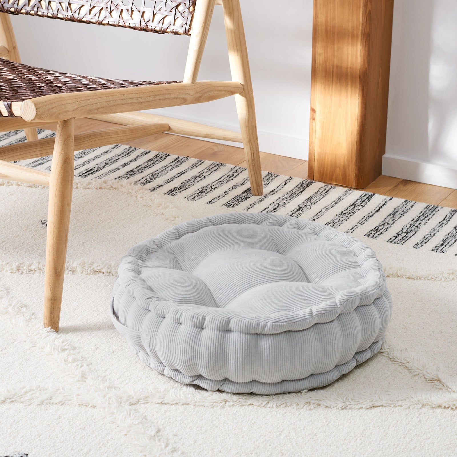 Round silver floor pillow with a thick cushioned profile and plush tufting for relaxed seating || FLP1021B || front_angle_room