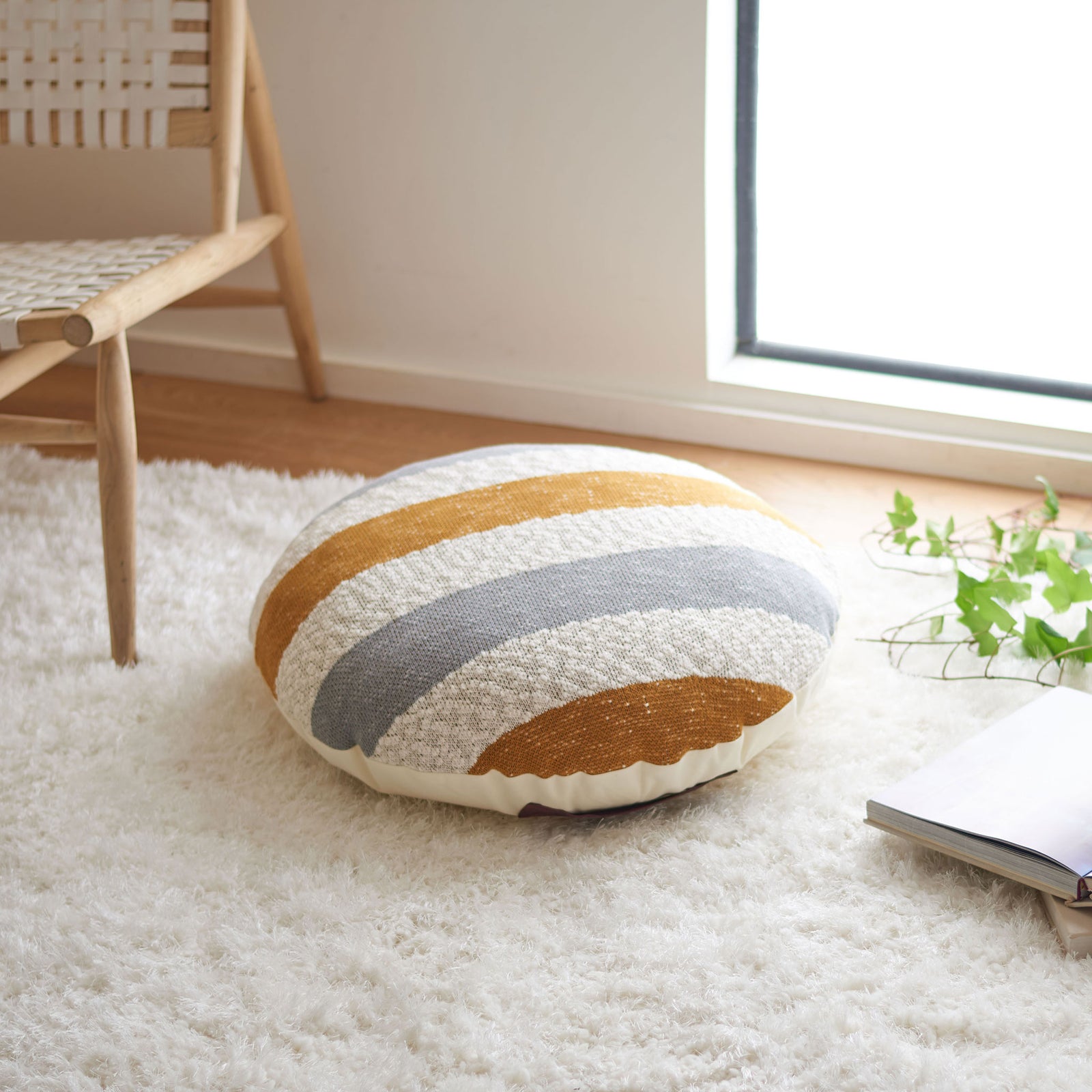 Plush striped floor pillow adds a cozy seat and warm mustard tones to a living space || FLP3001A || front_angle_room