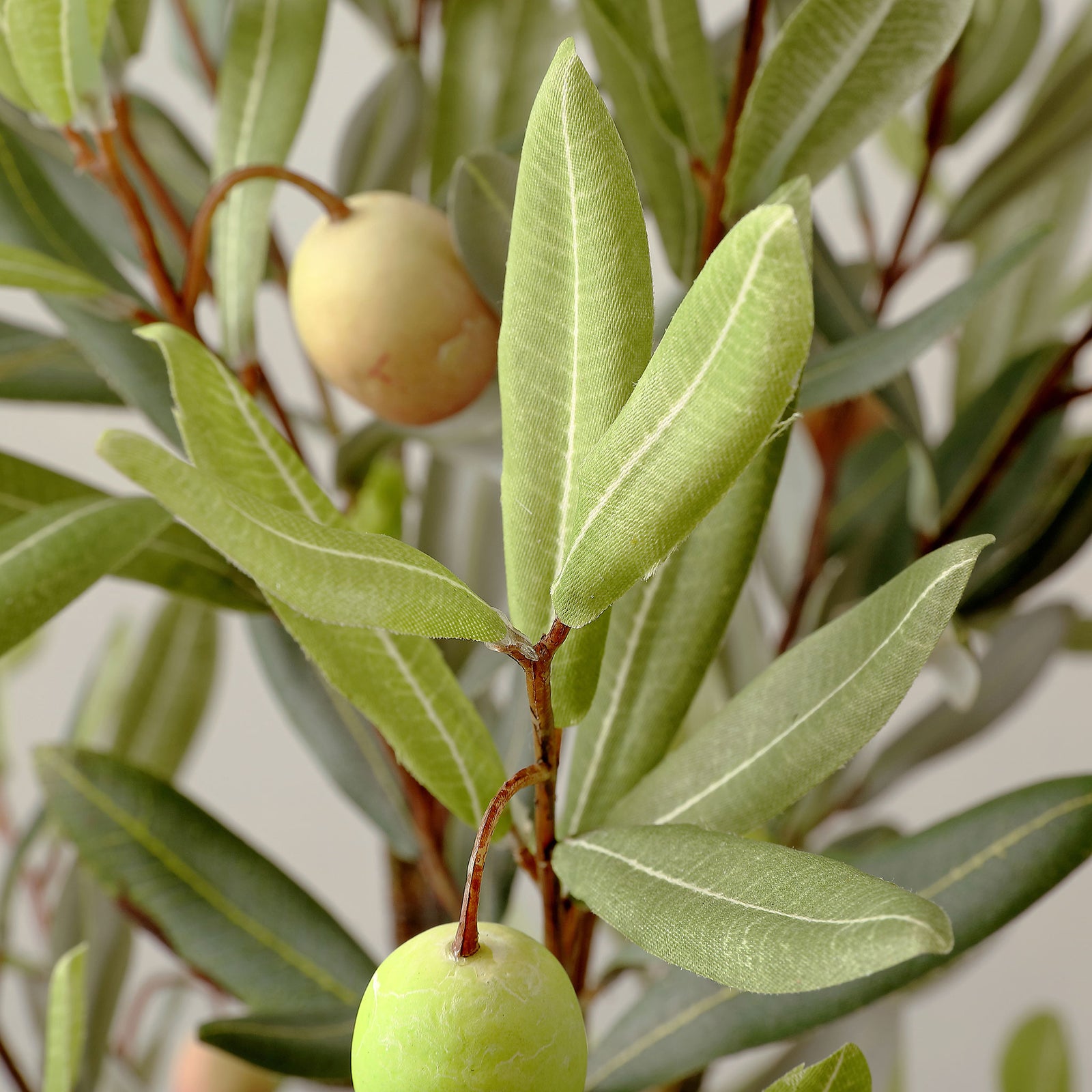 Faux olives and slender leaves add fine texture to branching stems. || FXP1007A || detail_studio
