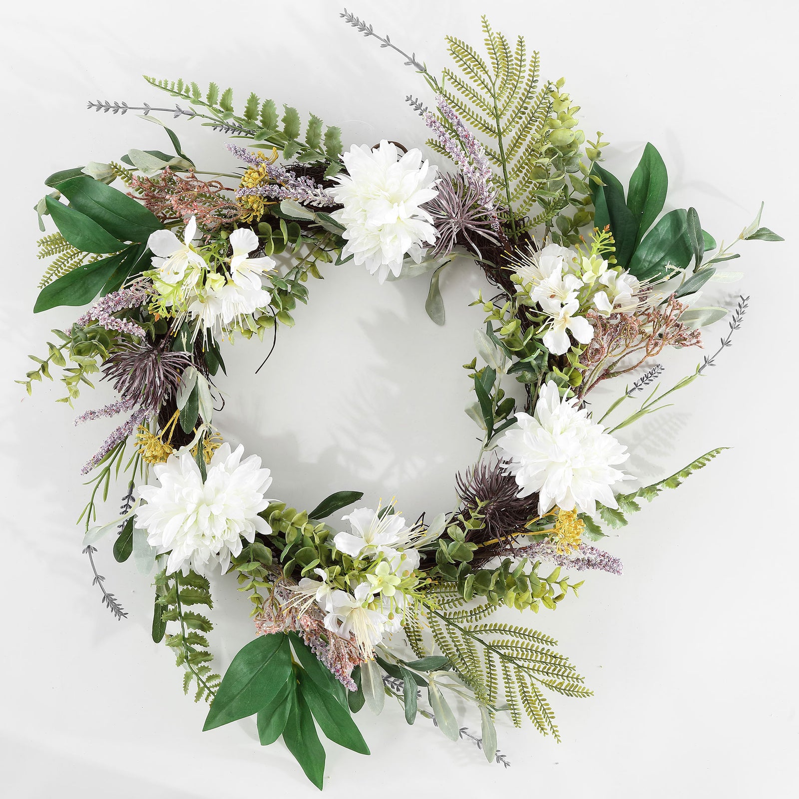White dahlias stand out against olive leaves and feathery foliage. || FXP1028A || front_studio