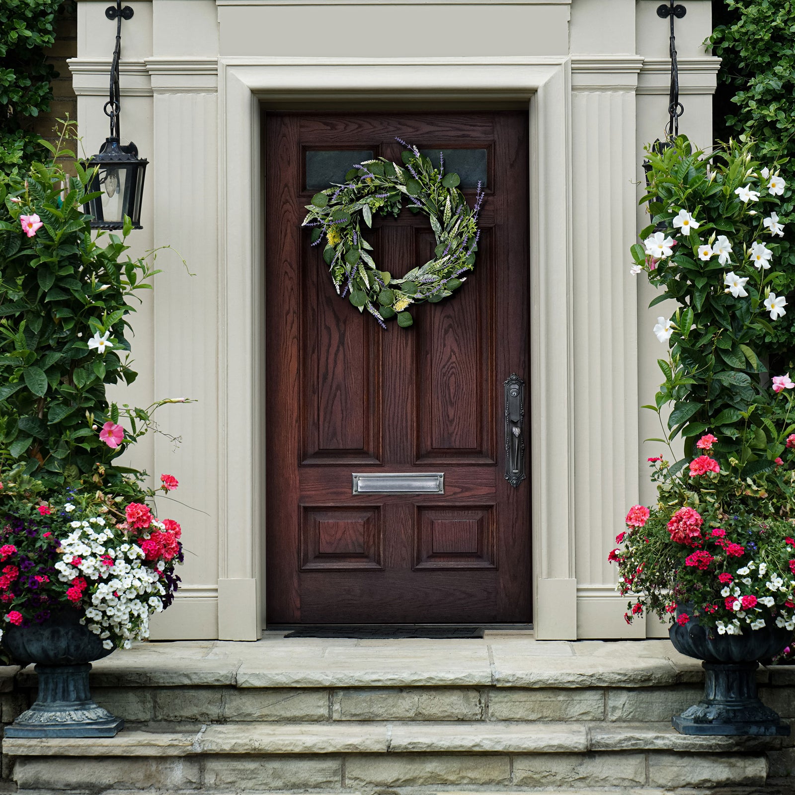 A verdant wreath brings a subtle touch of spring to a wood doorway. || FXP1029A || front_room