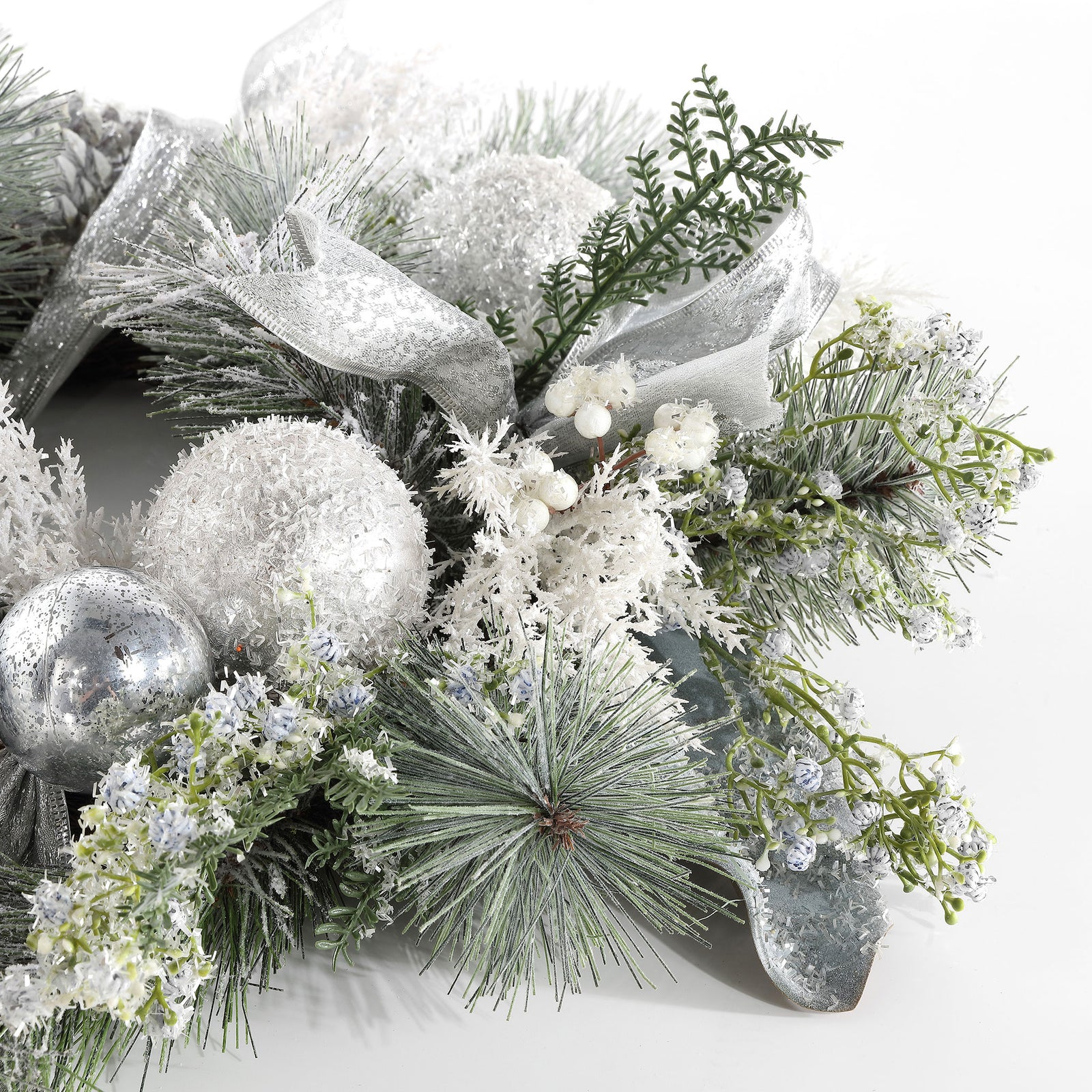 Frosted greenery surrounds shimmering baubles and soft silver ribbon. || FXP1077A || detail_studio