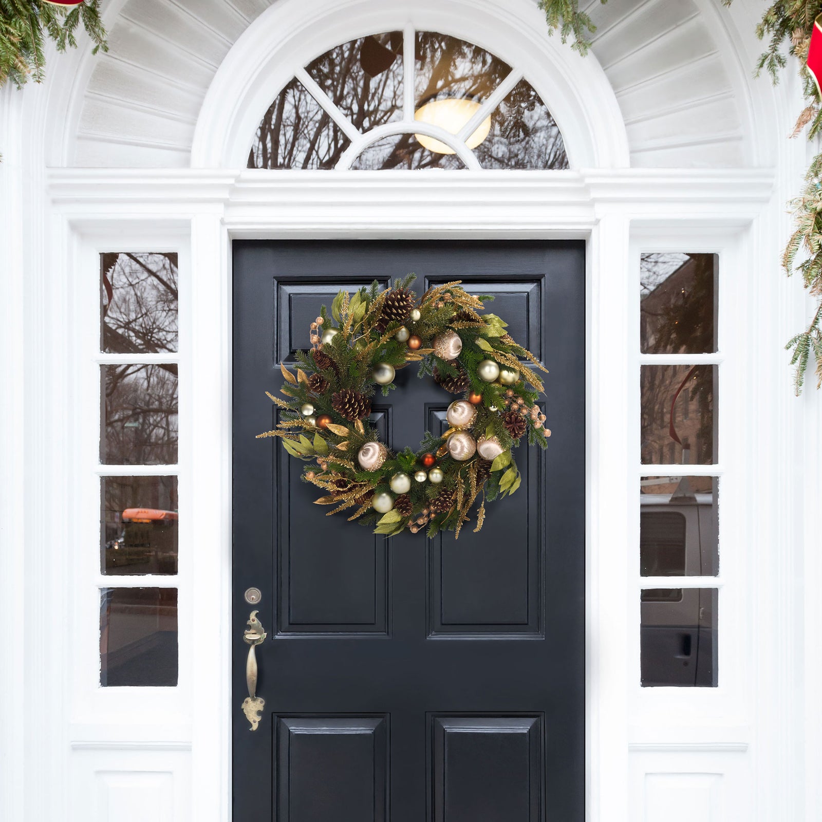 A full ring of greenery and metallic accents brightens a welcoming holiday entryway || FXP1098A || front_room