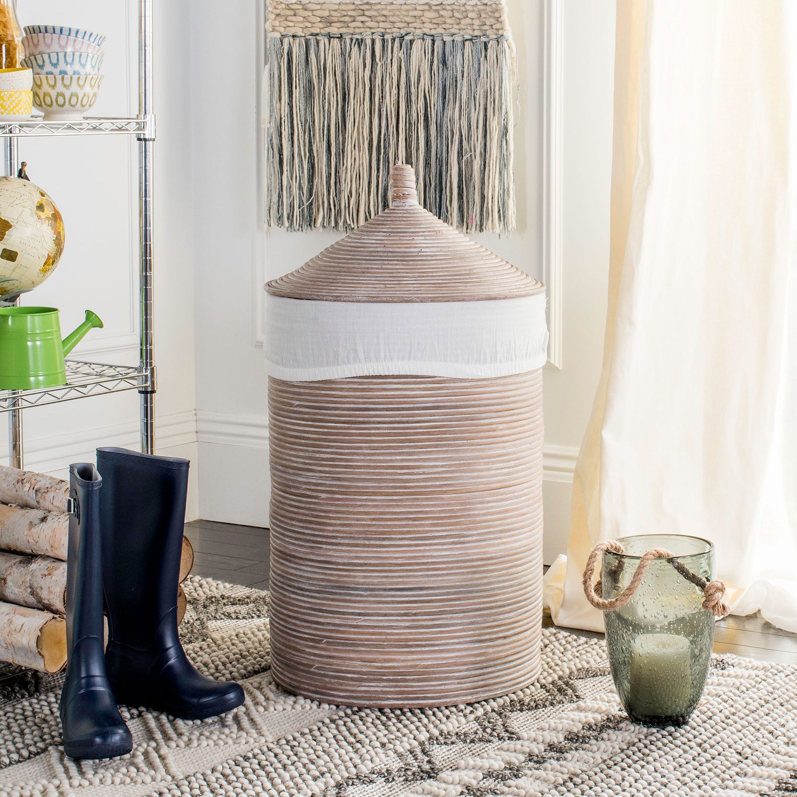Tall whitewashed rattan hamper brings woven texture and discreet storage to a relaxed room || HAC6501A || front_room