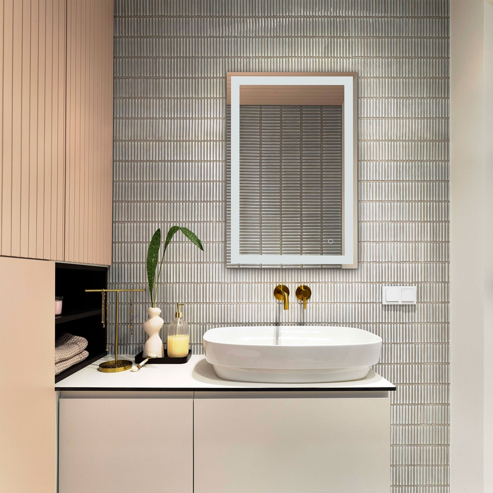 A slim silver-edged mirror complements textured tile and a white vanity with modern simplicity || LMR1000A || front_room