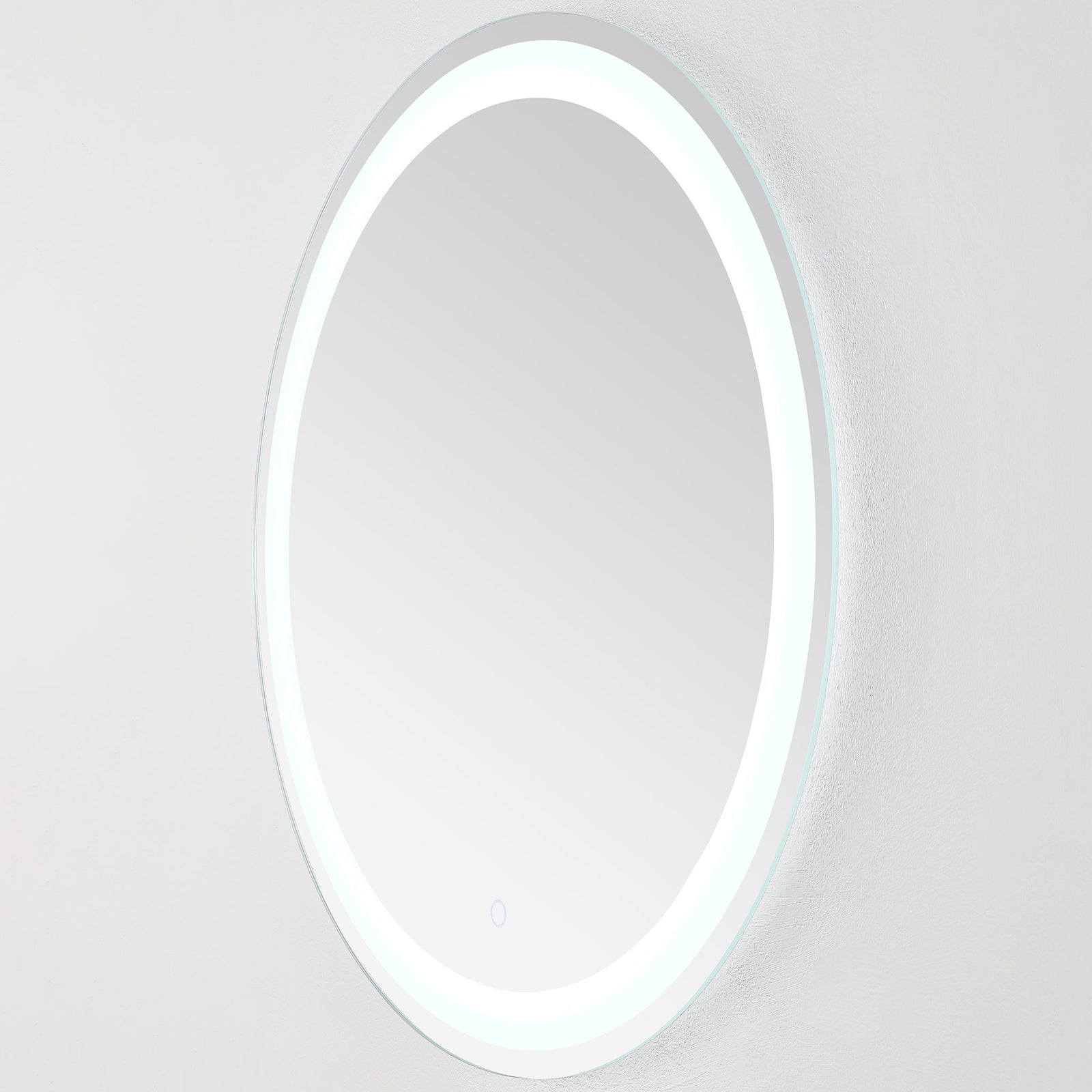 A narrow silver frame surrounds the round mirror as its bright white LED band shines || LMR1001A || side_on_studio
