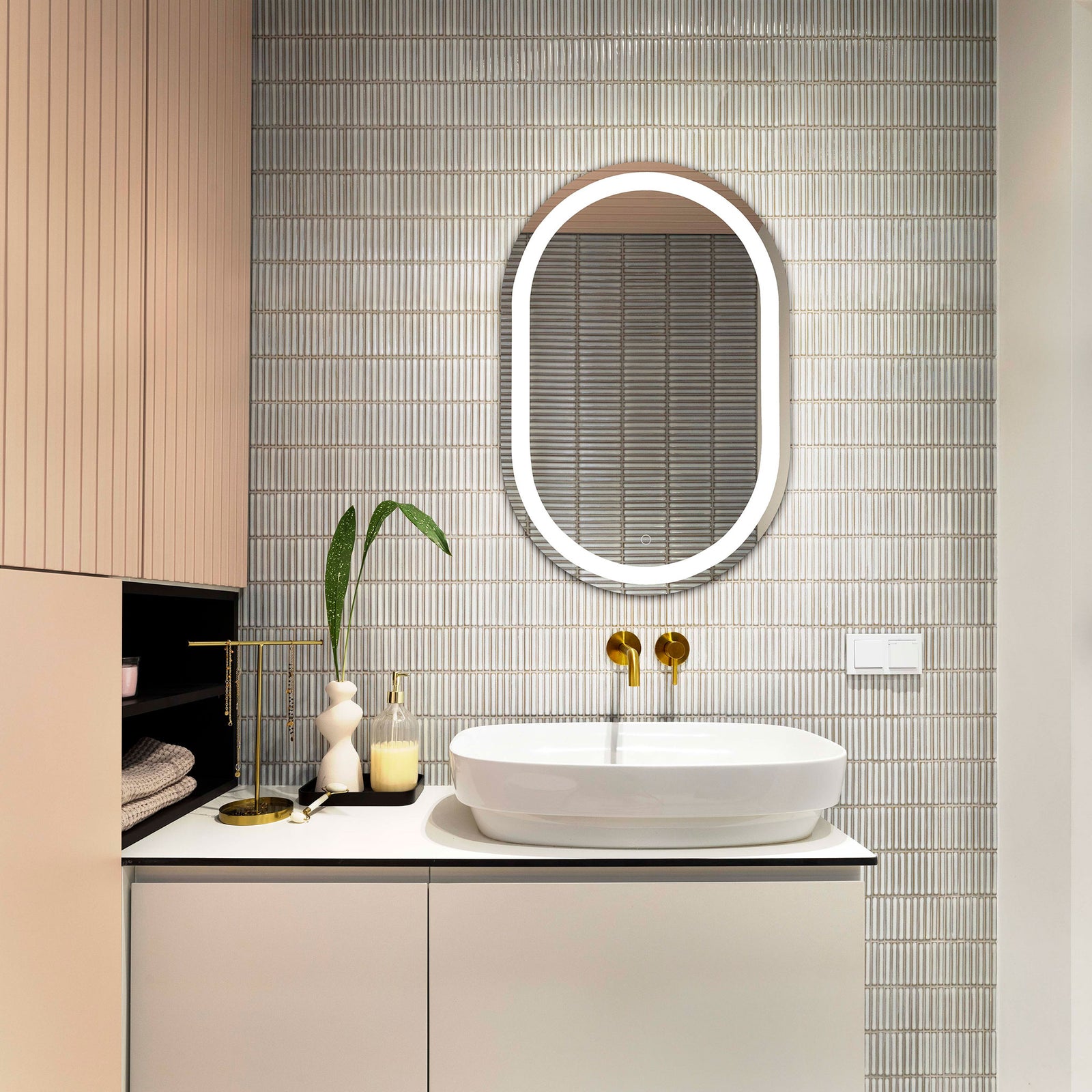 Bright white LED border illuminates a rounded mirror above a modern bathroom vanity || LMR1002A || front_on_room