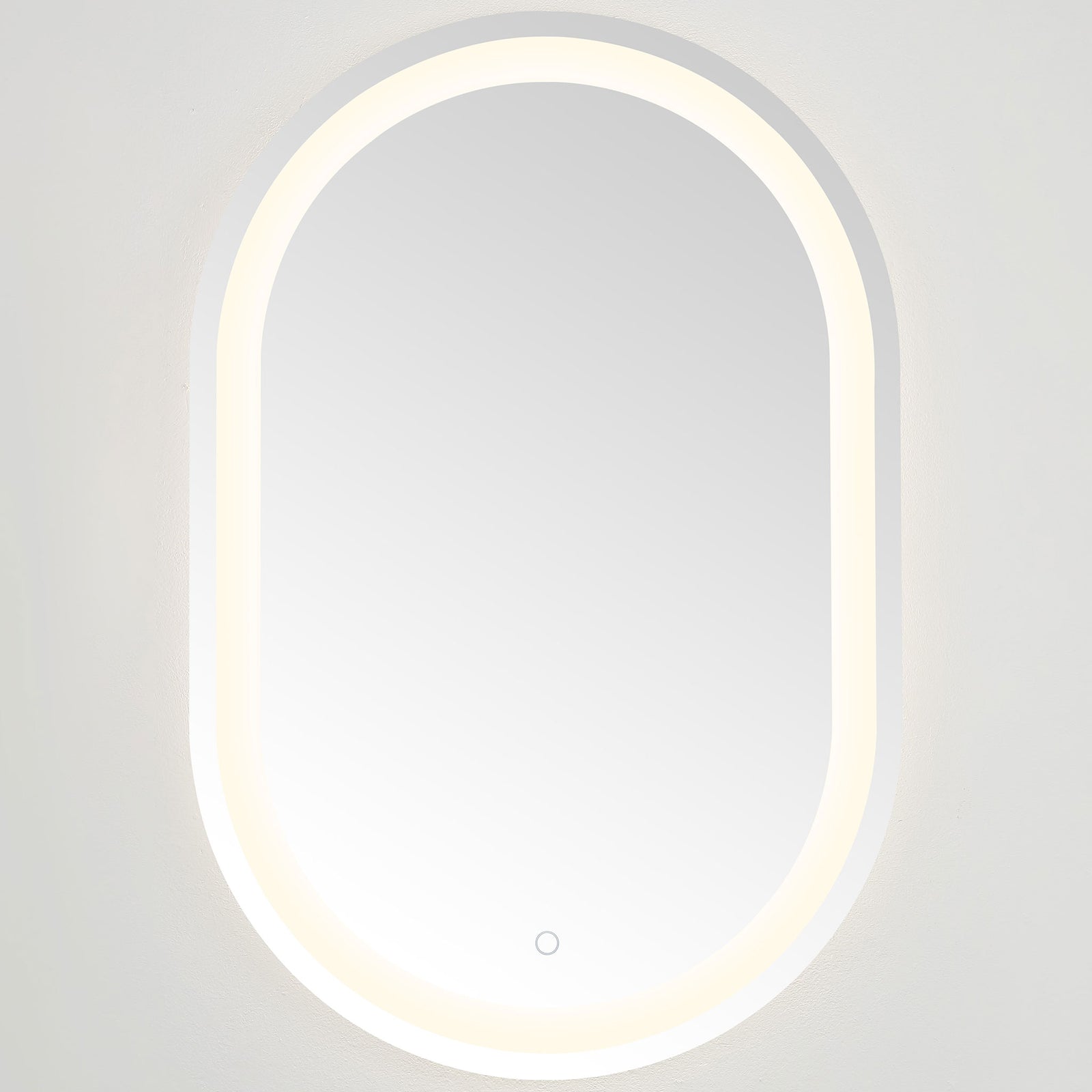 Soft white illumination frames the smooth mirror glass and gently arched ends || LMR1002A || front_on_studio