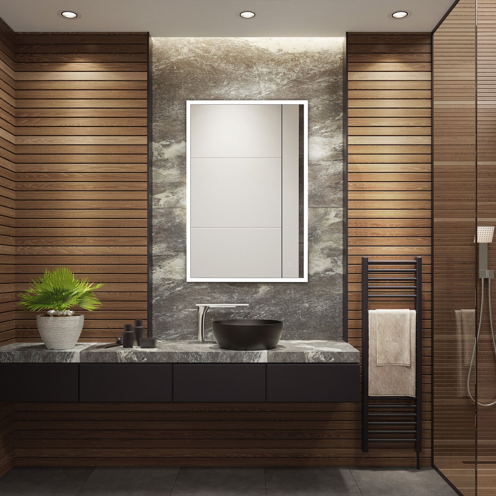 A glowing white border illuminates the mirror above a dark stone vanity and black vessel sink. || LMR1003A || front_on_room