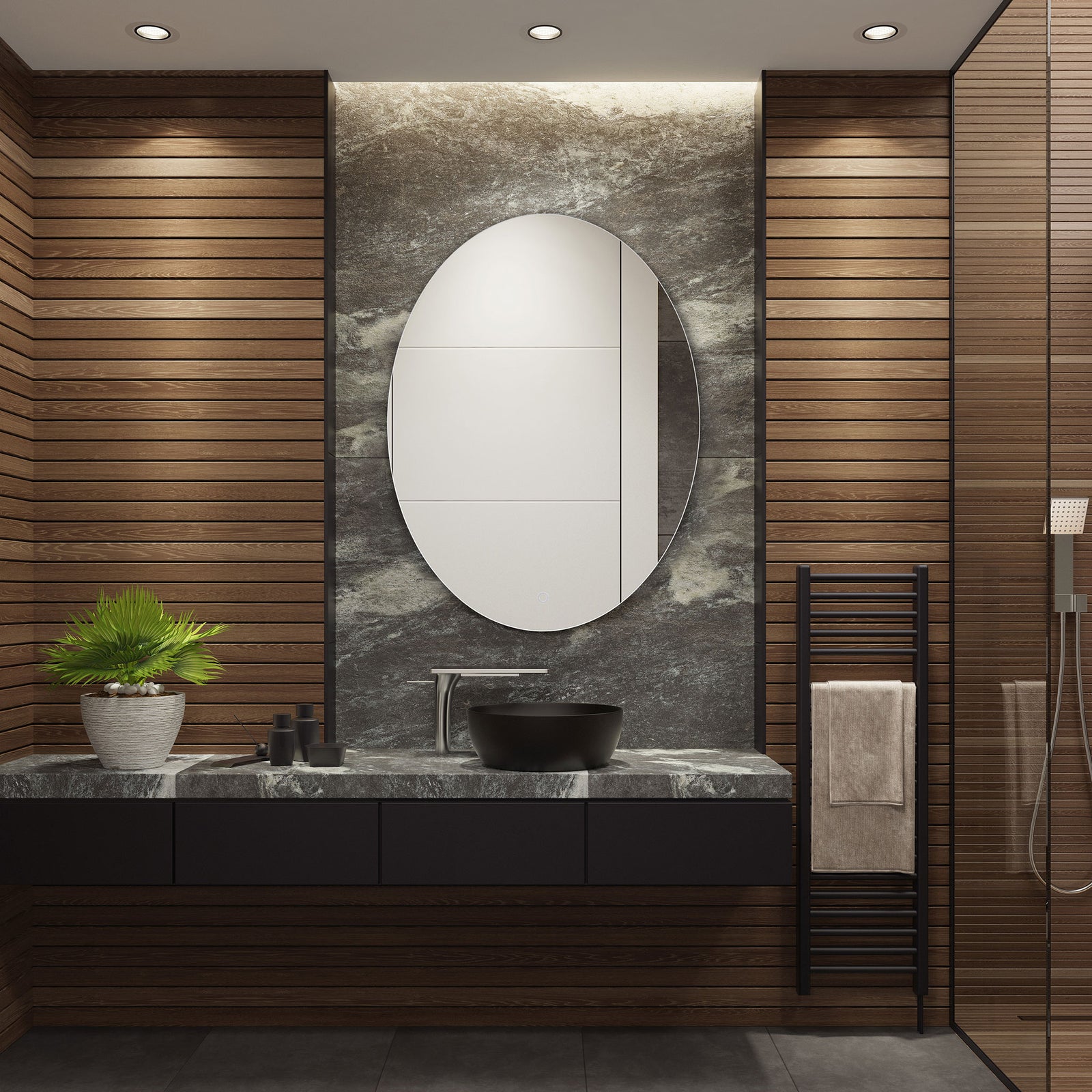 A sleek oval mirror brings a clean, modern accent to a dark stone bathroom vanity || LMR1005A || front_room