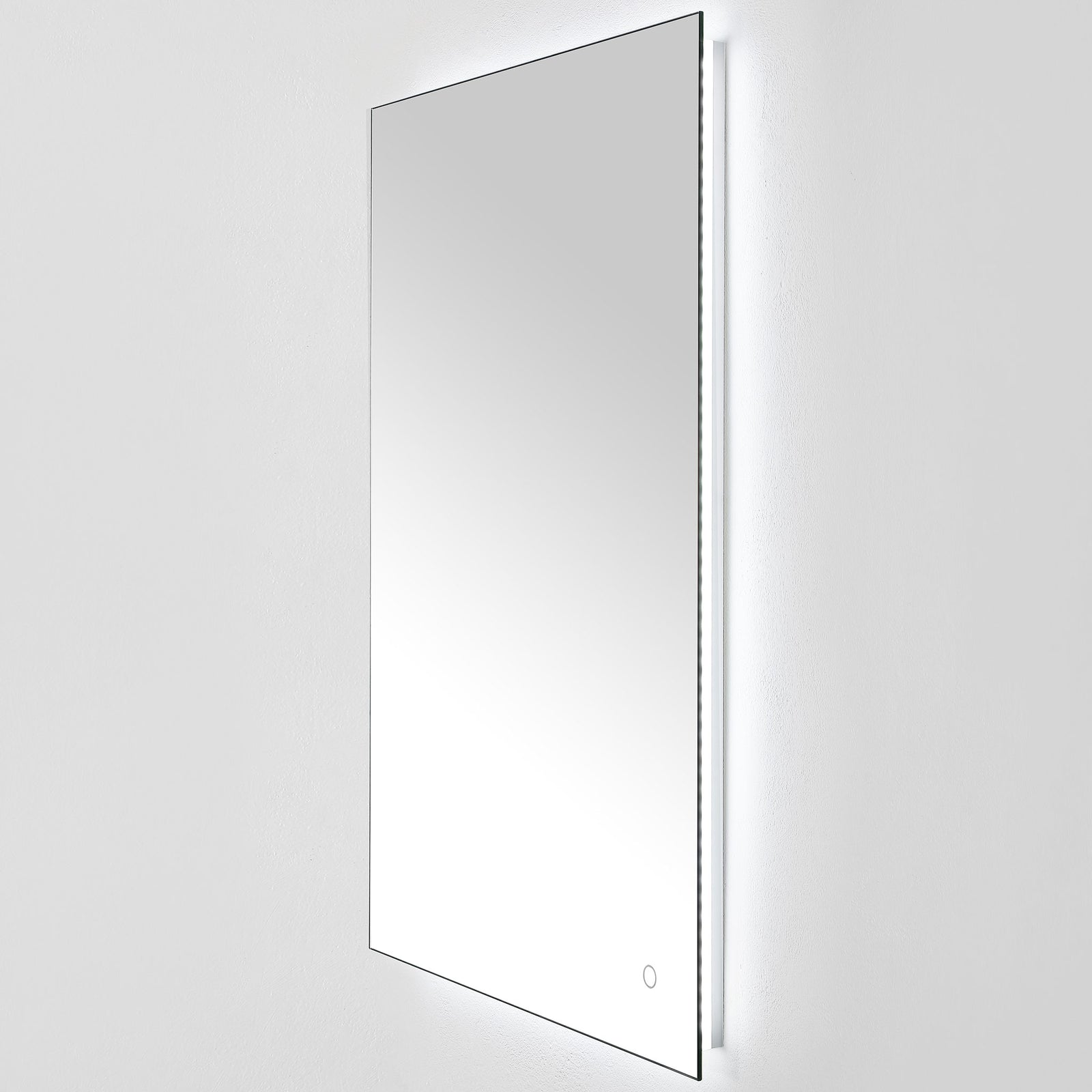 A crisp white LED glow shines from behind the tall mirror's slim reflective surface. || LMR1006A || front_angle_on_studio