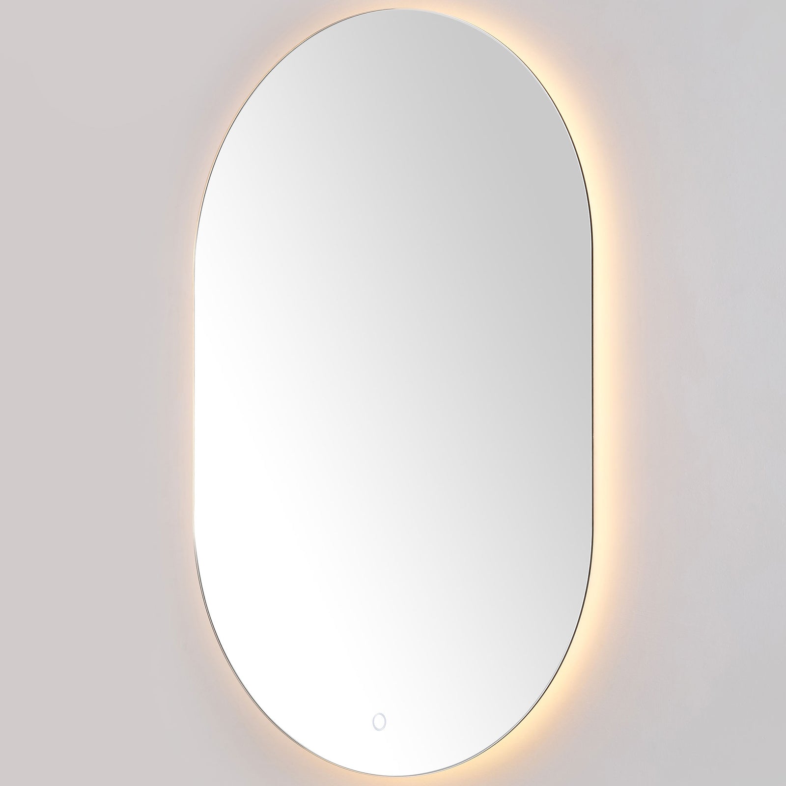 Warm perimeter lighting accentuates the mirror's curved edges and slim aluminum frame. || LMR1007A || front_angle_on_studio