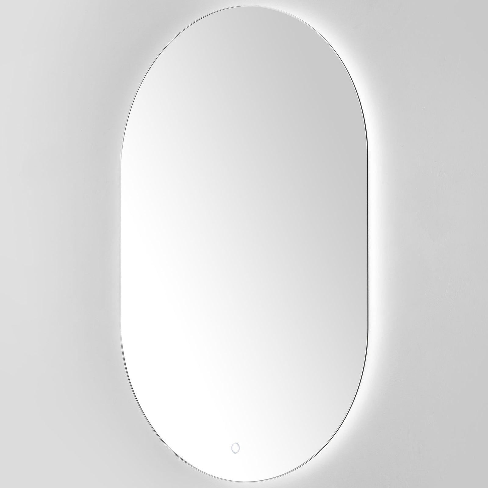 Cool white backlighting lends the rounded mirror a crisp, contemporary finish. || LMR1007A || front_angle_on_studio