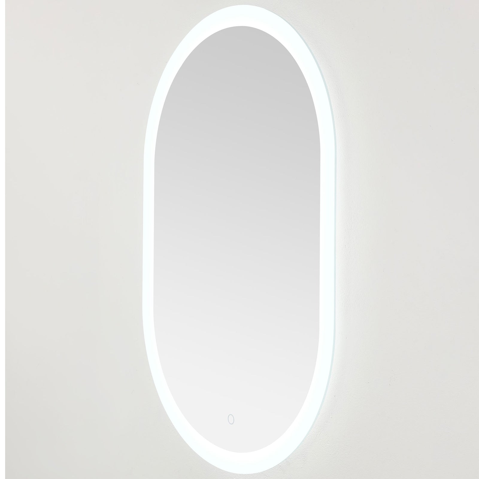 Cool white lighting outlines the slim oval mirror and creates a gentle wall glow || LMR1009A || front_angle_on_studio