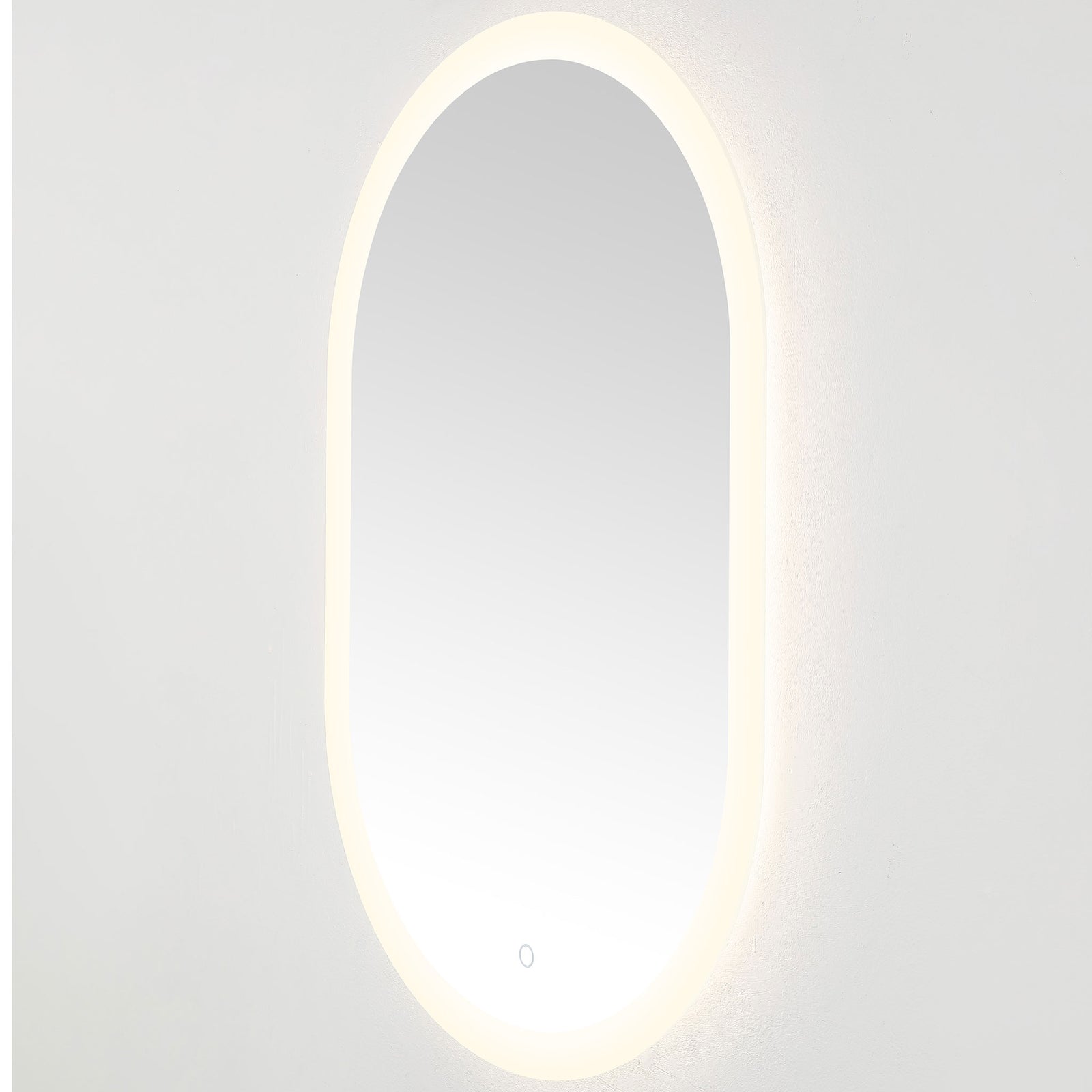 Soft white LEDs illuminate the rounded mirror and cast a subtle glow against the wall || LMR1009A || front_angle_on_studio