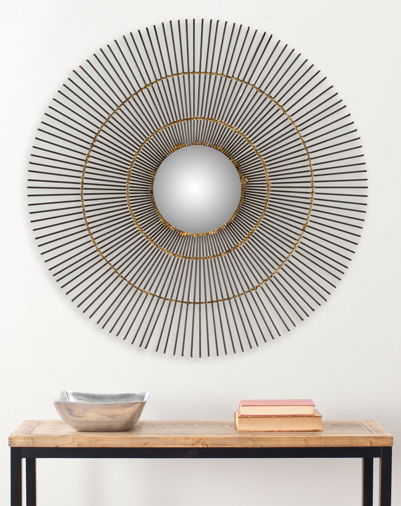 Slender sunburst spokes and concentric gold rings give this round wall mirror sculptural appeal. || MIR4021A || front_room
