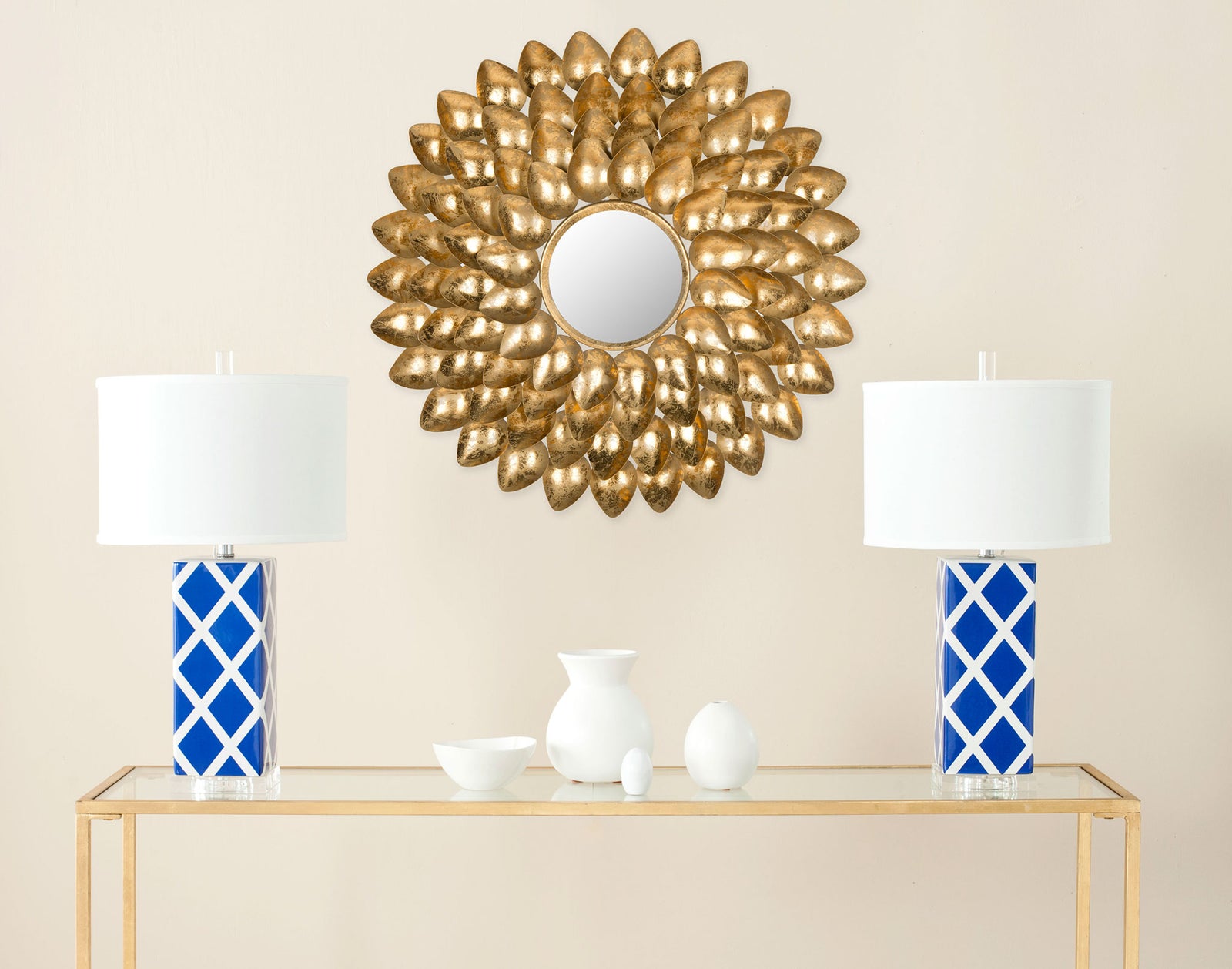 An antique gold sunburst mirror brings sculptural warmth to the wall above a console || MIR4029A || front_room