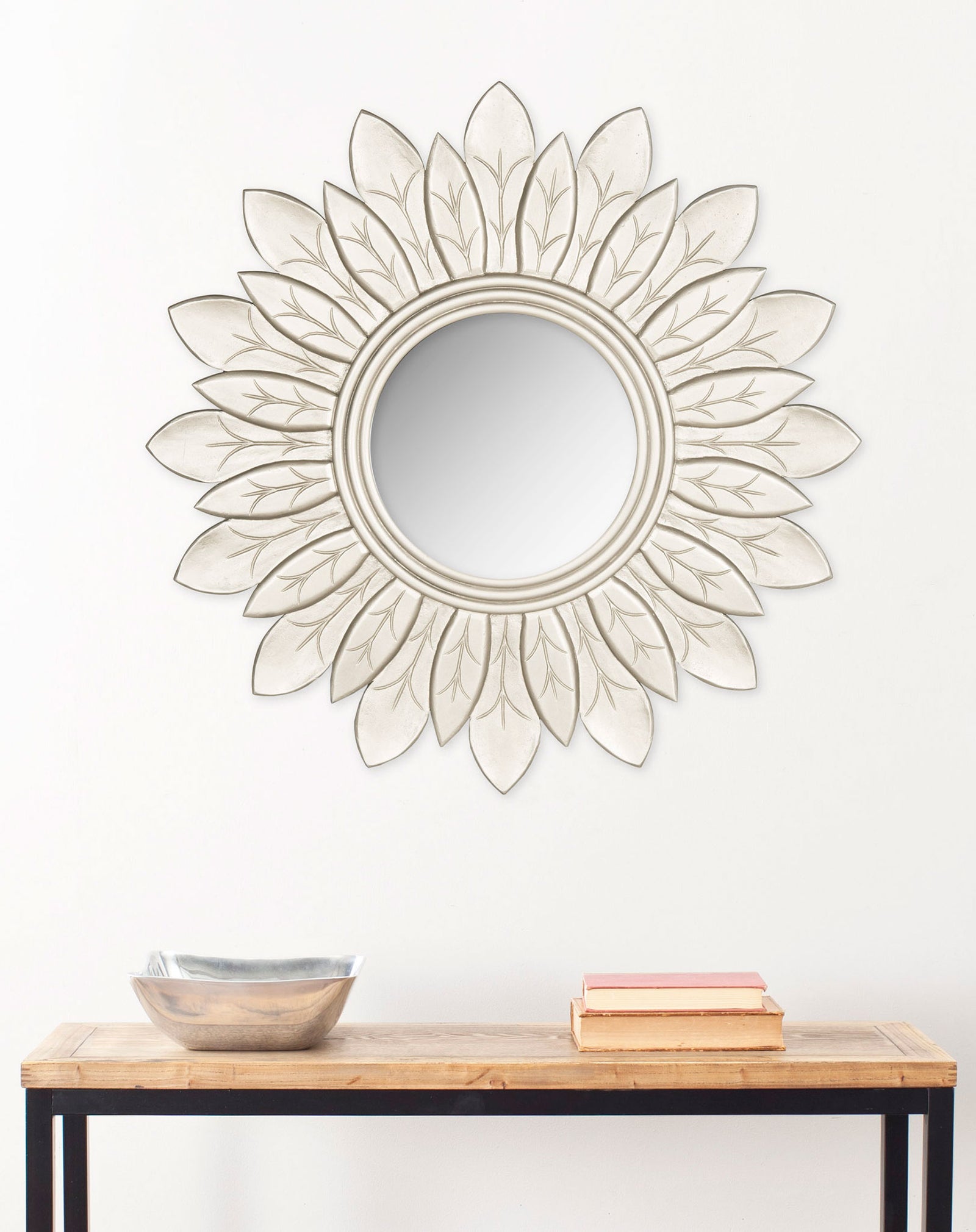A pewter sunburst mirror creates a classic focal point above a simple console || MIR5003B || front_room