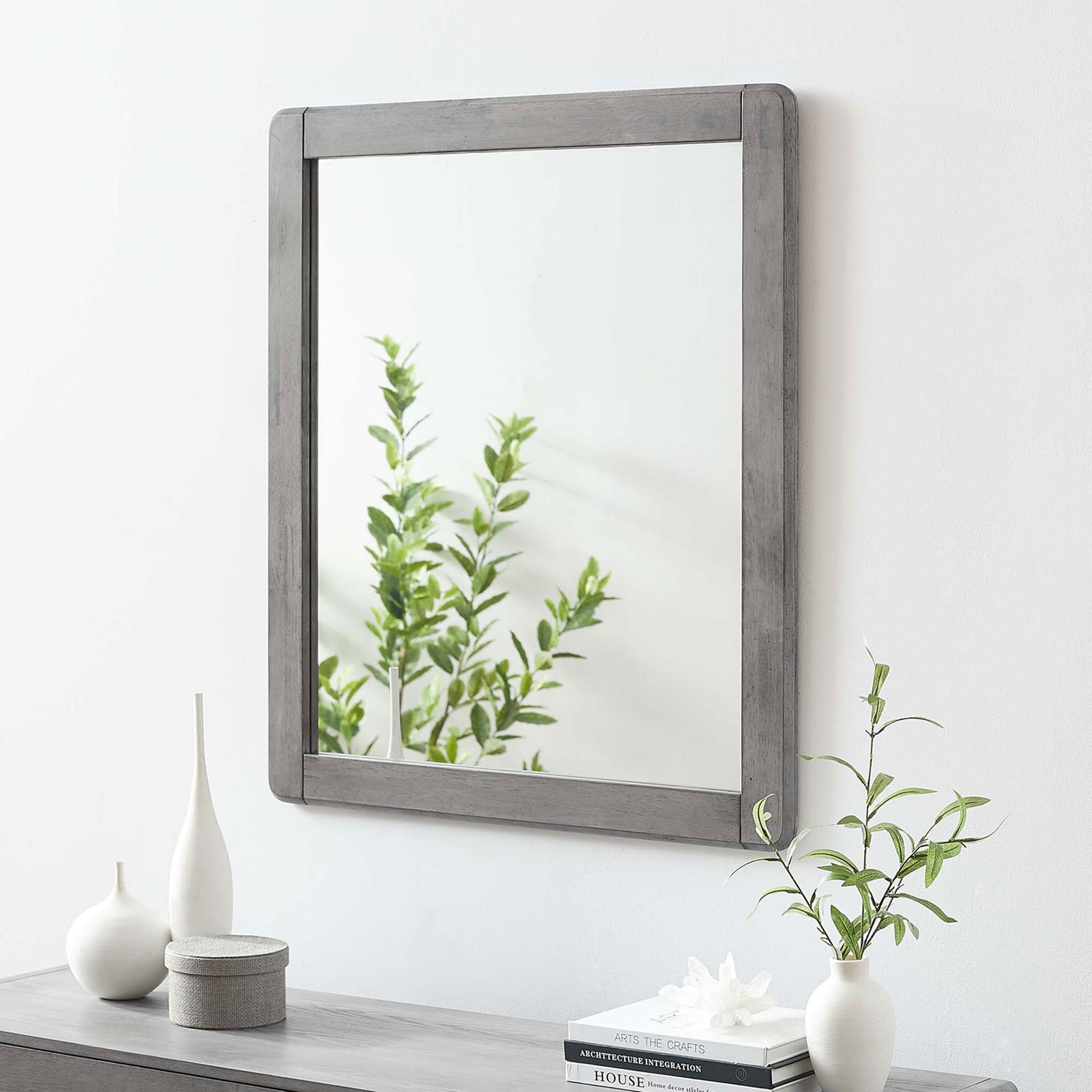 Georgia gray wood mirror styled above a console table with modern decorative accents || MOD-6243-GRY || front_angle_room