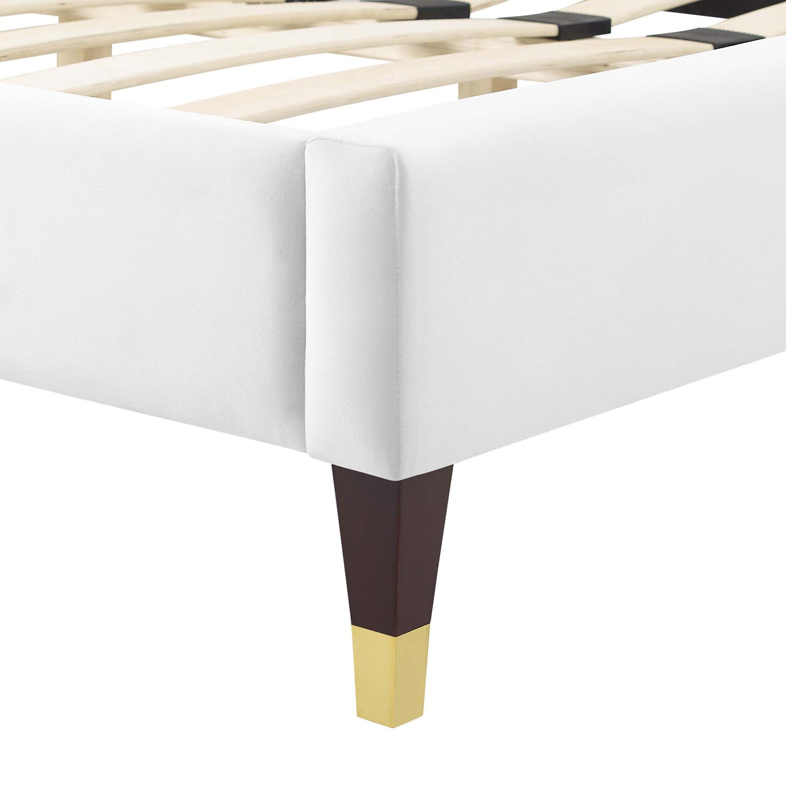 Gold-capped tapered leg and smooth velvet upholstery at the corner. || MOD-6596-WHI || leg_studio