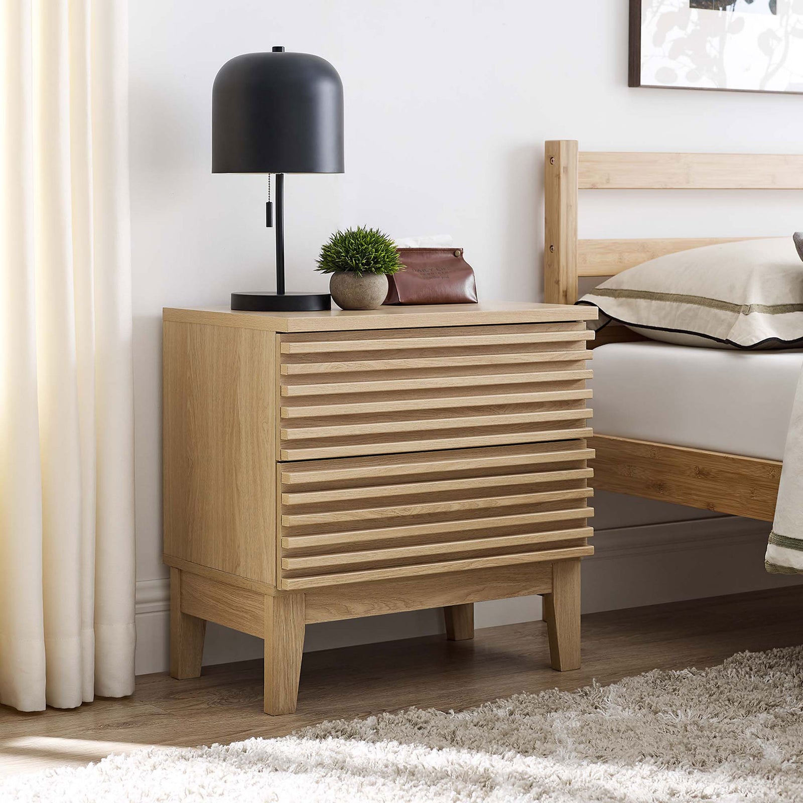 Render oak nightstand beside a modern bed, topped with a sleek lamp and decor for warm bedroom style || MOD-6964-OAK || front_angle_room