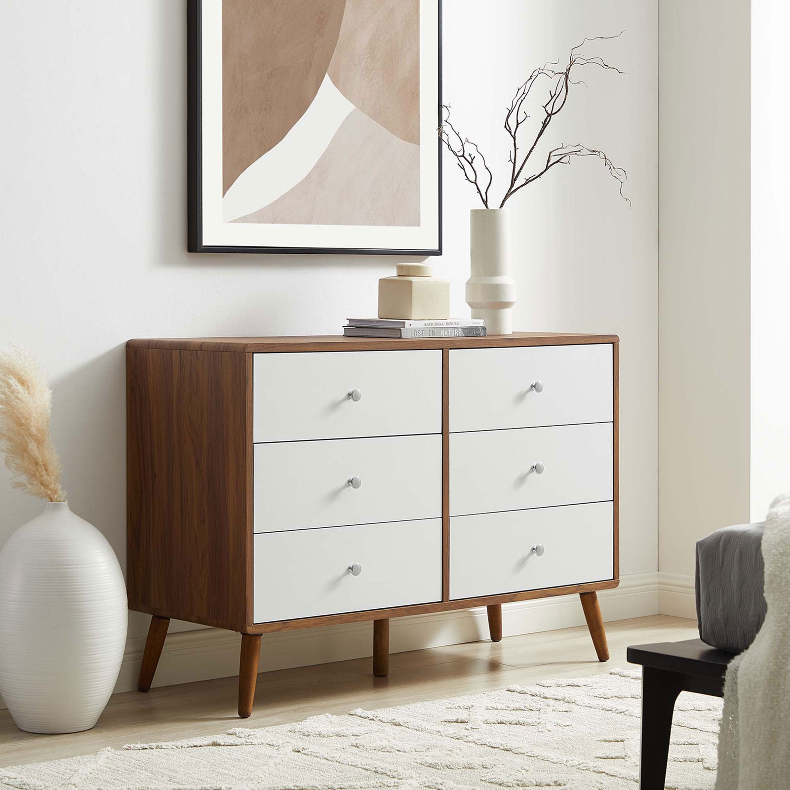 Six-drawer walnut and white dresser styled in a bright bedroom with modern neutral decor. || MOD-7021-WAL-WHI || front_angle_room