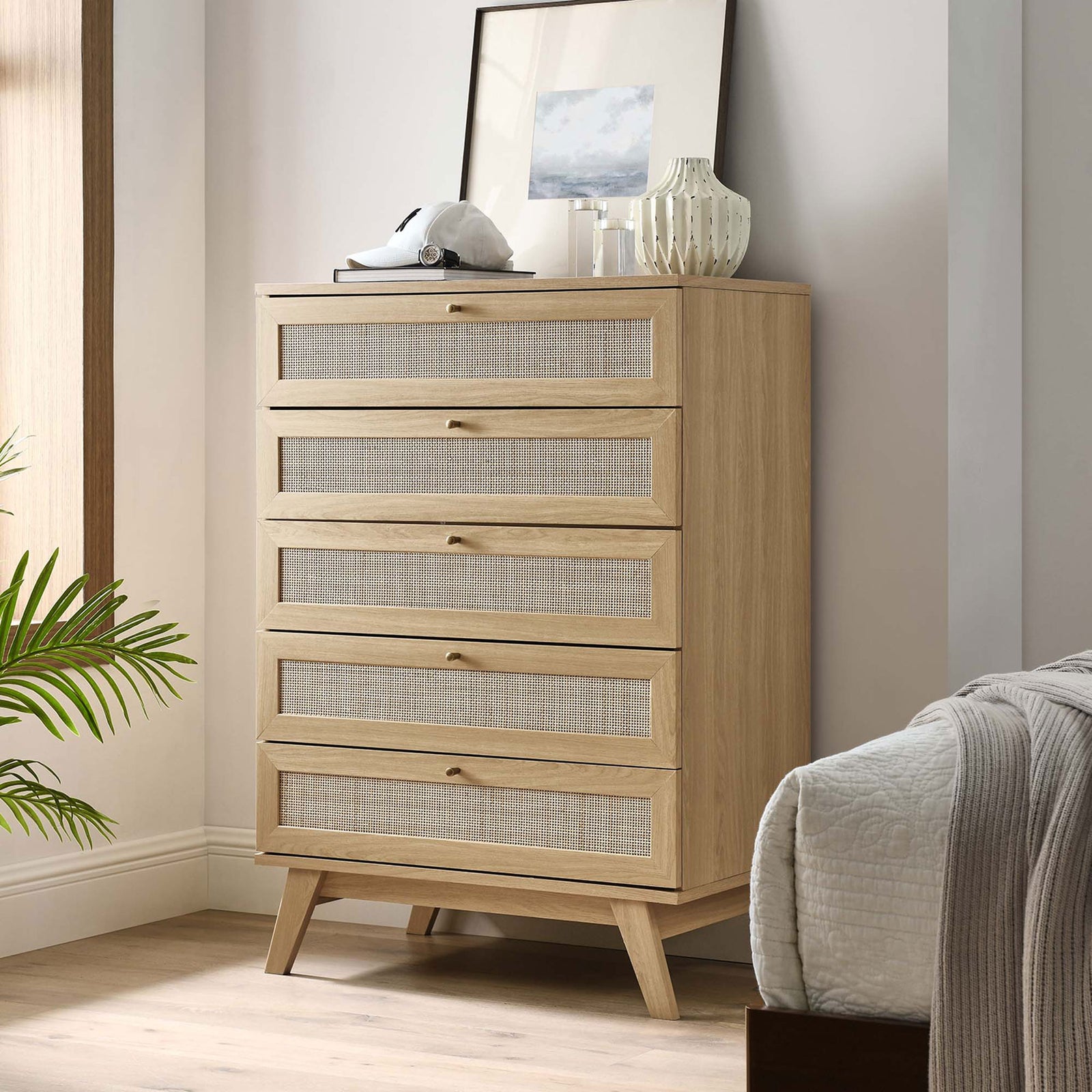 Oak 5-drawer chest styled in a cozy bedroom with decor on top and warm natural light || MOD-7052-OAK || front_angle_room