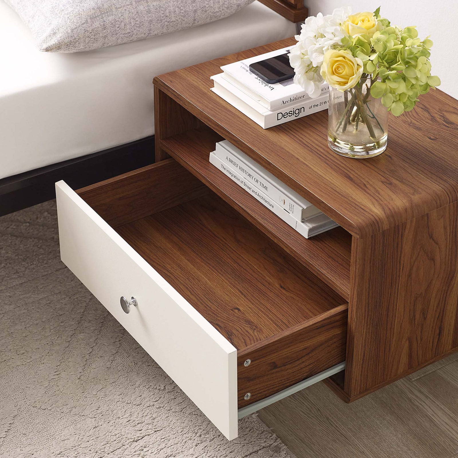 Nightstand mounted by the bed with drawer open, displaying books and decor in a cozy bedroom setting || MOD-7059-WAL-WHI || storage_open_room