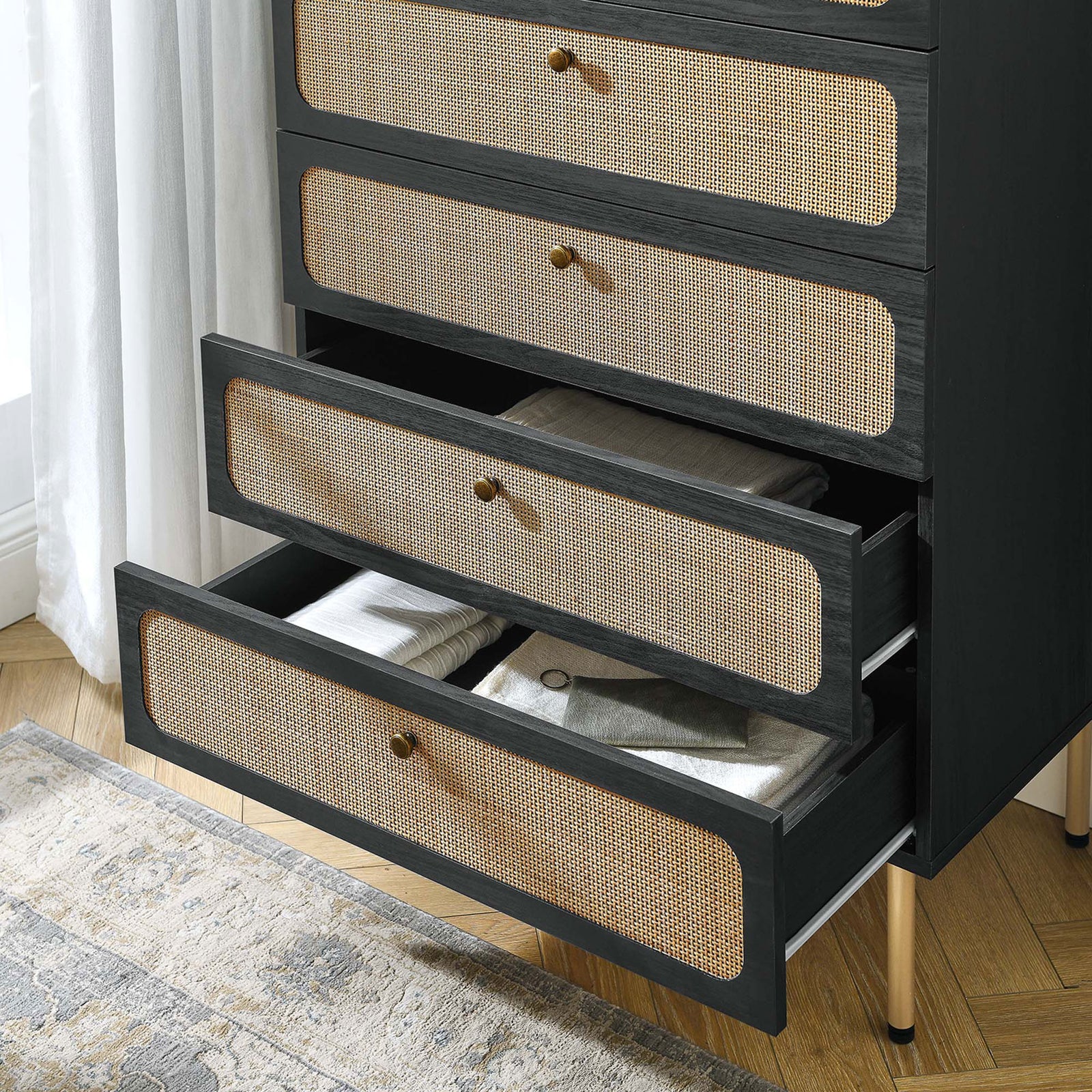 Open drawers display neatly folded linens, showing how the black rattan chest adds texture to bedroom storage || MOD-7065-BLK || storage_open_room