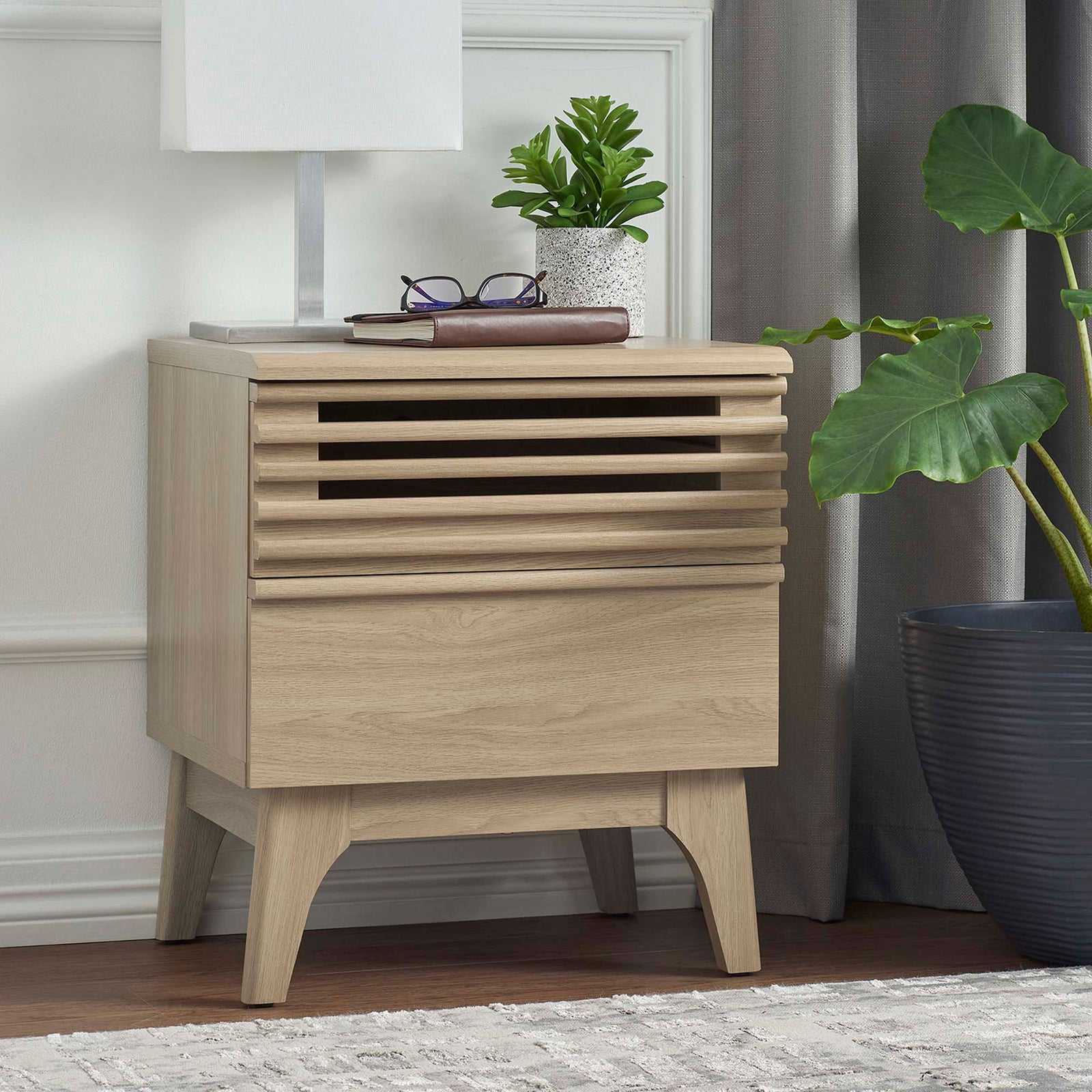 Oak nightstand styled in a bedroom with lamp, plant, and drapery for a fresh mid-century look || MOD-7071-OAK || front_angle_room