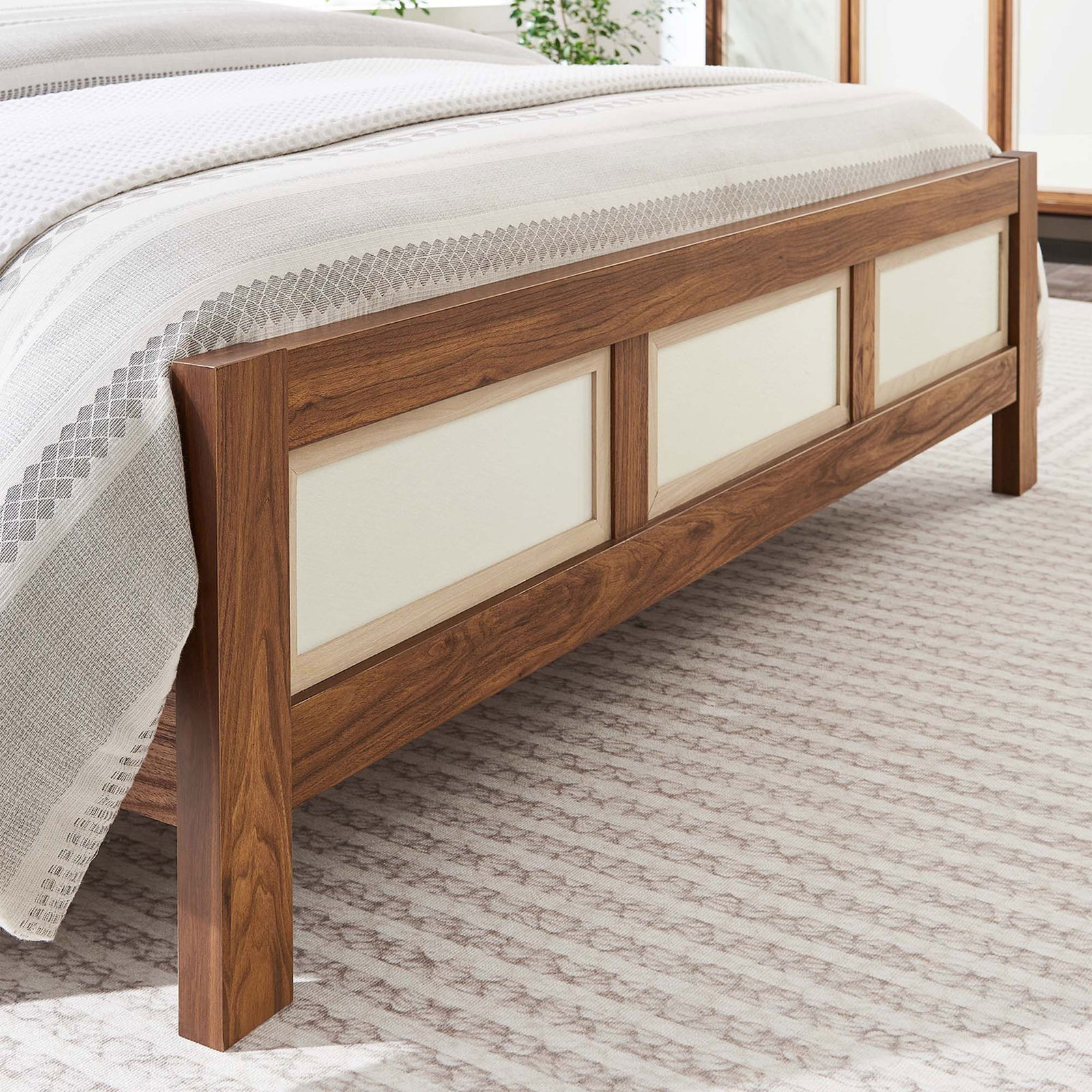 Footboard detail shows linen-textured panels and walnut grain in a bright, airy bedroom || MOD-7119-WAL || detail_room