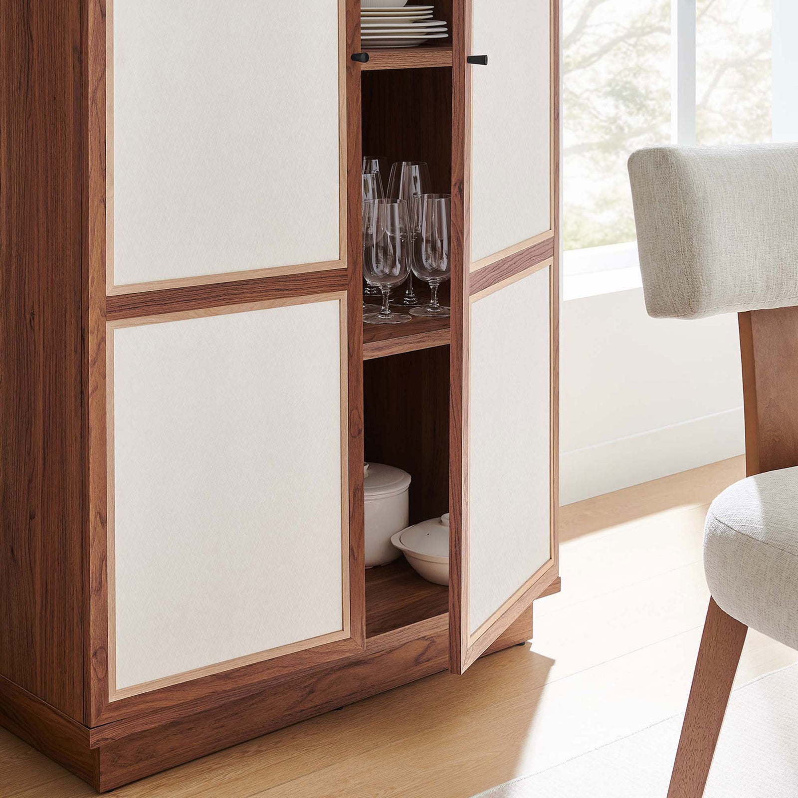 Cabinet in use with center doors open displaying neatly arranged glassware and dinner dishes || MOD-7156-WAL || storage_open_room