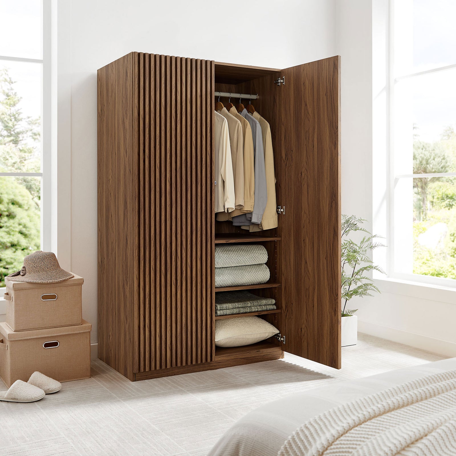 Walnut wardrobe in a styled bedroom with one door closed and the other revealing interior storage || MOD-7182-WAL || front_angle_open_room