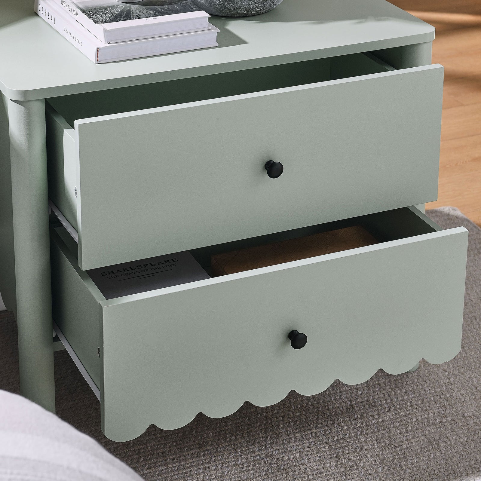 Cozy bedroom scene with the sage Emmeline nightstand, its drawers open to keep nighttime essentials within reach. || MOD-7206-SGE || storage_open_room