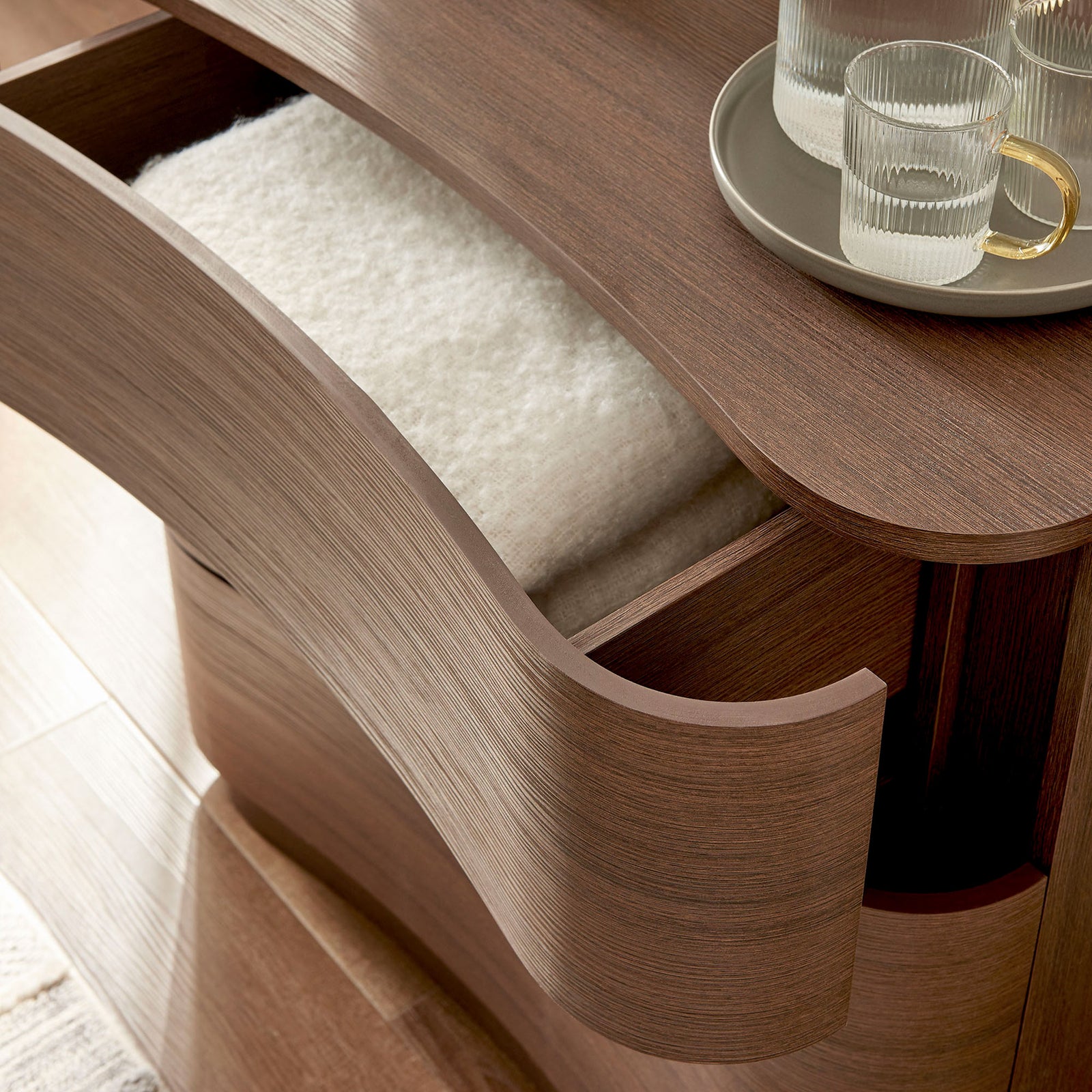 Drawer filled with soft textiles showing everyday storage use and rich brown oak texture || MOD-7230-BBO || storage_open_room