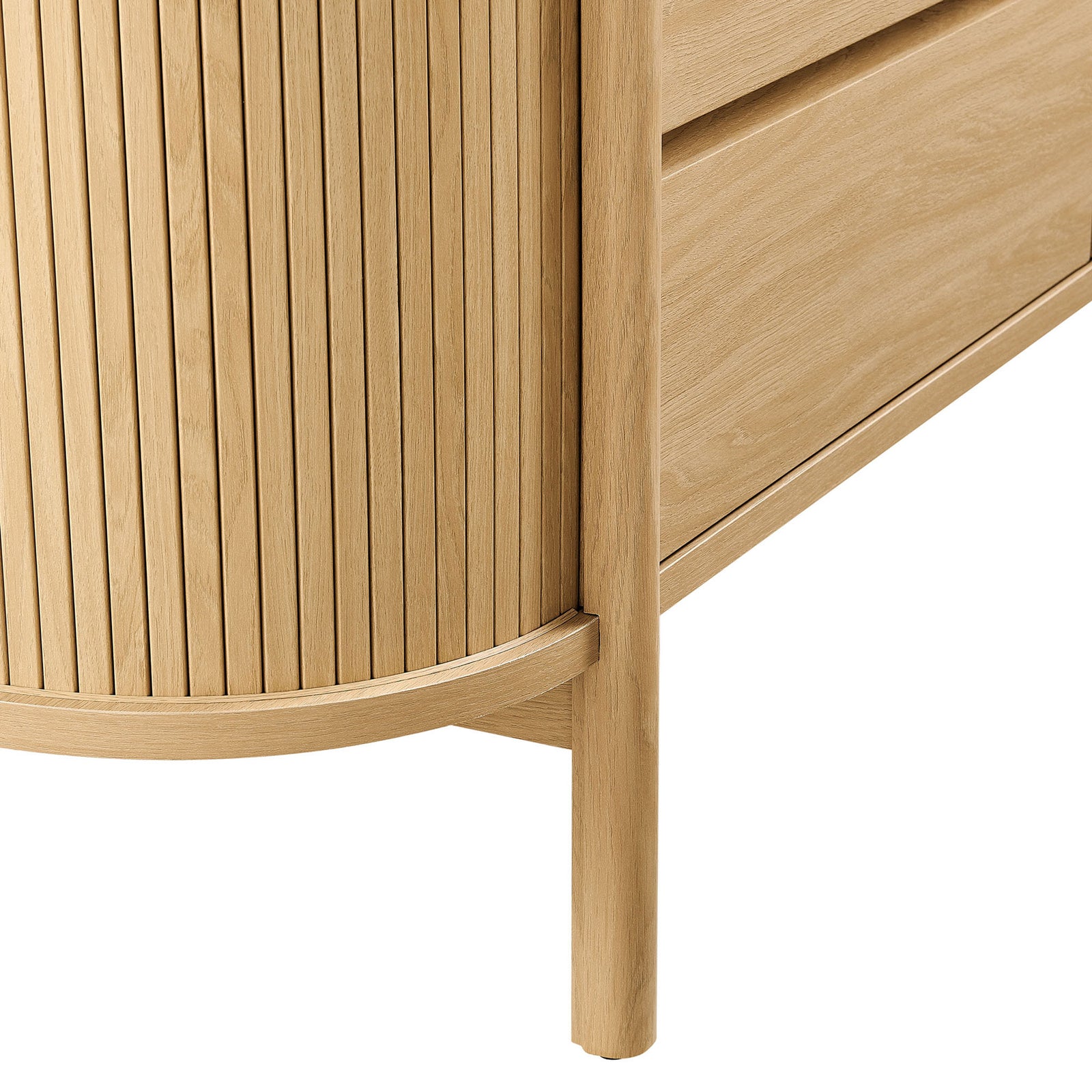 Close-up of dresser base showing rounded leg, curved frame, and vertical fluted side paneling || MOD-7242-OAK || leg_studio