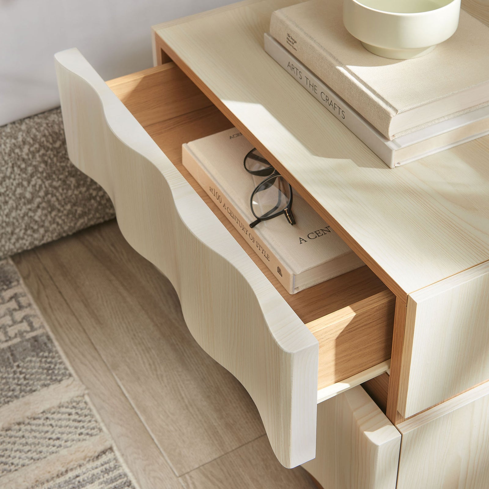 Nightstand styled with books and decor, showing the roomy top drawer storing everyday bedside essentials. || MOD-7243-WHI-LOA || storage_open_room