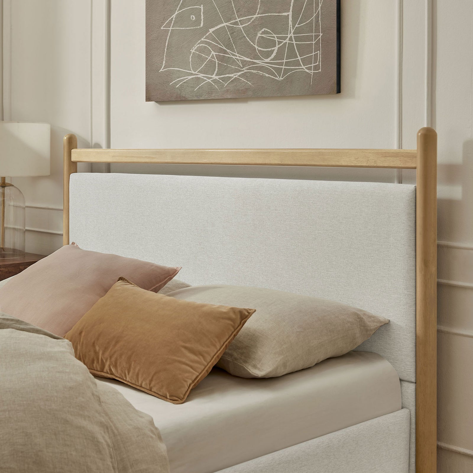 Textured ivory upholstery pairs with warm wood for a cozy, modern headboard feel || MOD-7248-LOA-HEI || detail_room
