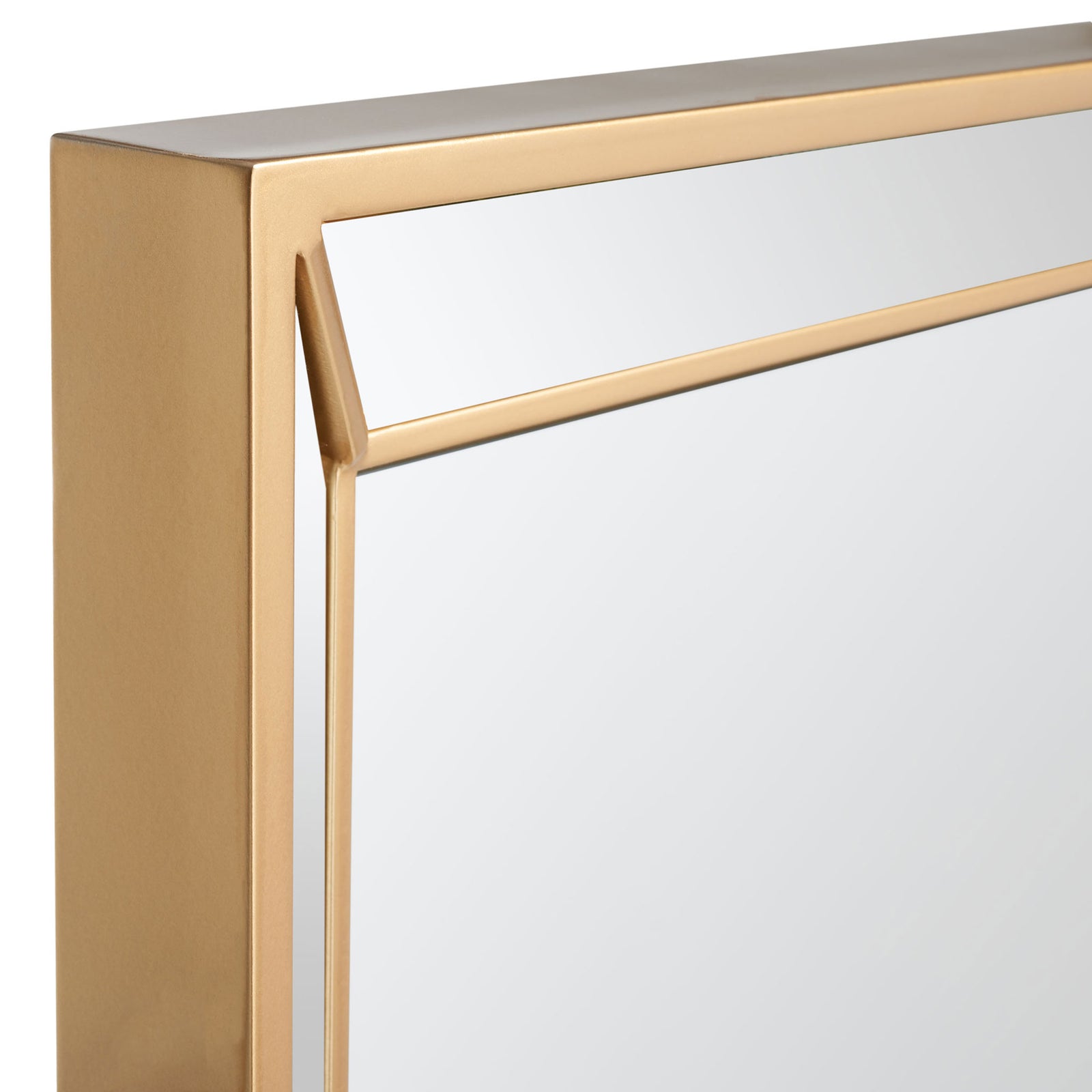Brass-tone metal framing meets slim diagonal corner trim around the mirror's reflective inset. || MRR2004A || detail_studio