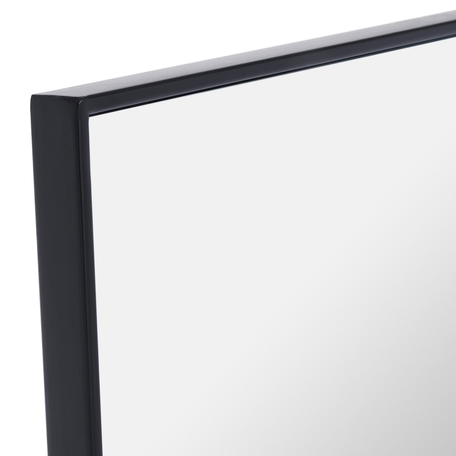 Slim black metal edges meet neatly at the corner of this tall rectangular mirror || MRR2008C || detail_studio