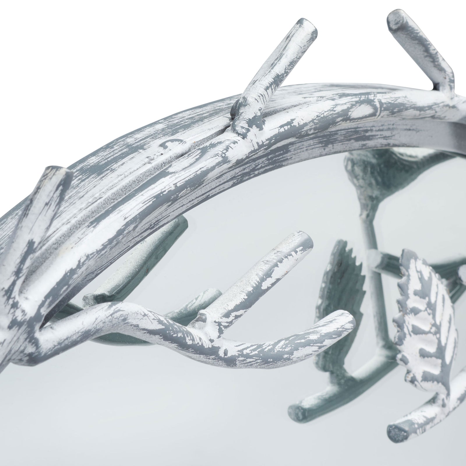 Weathered silver branches and sculpted leaves add woodland character to the mirror frame. || MRR3042A || detail_studio