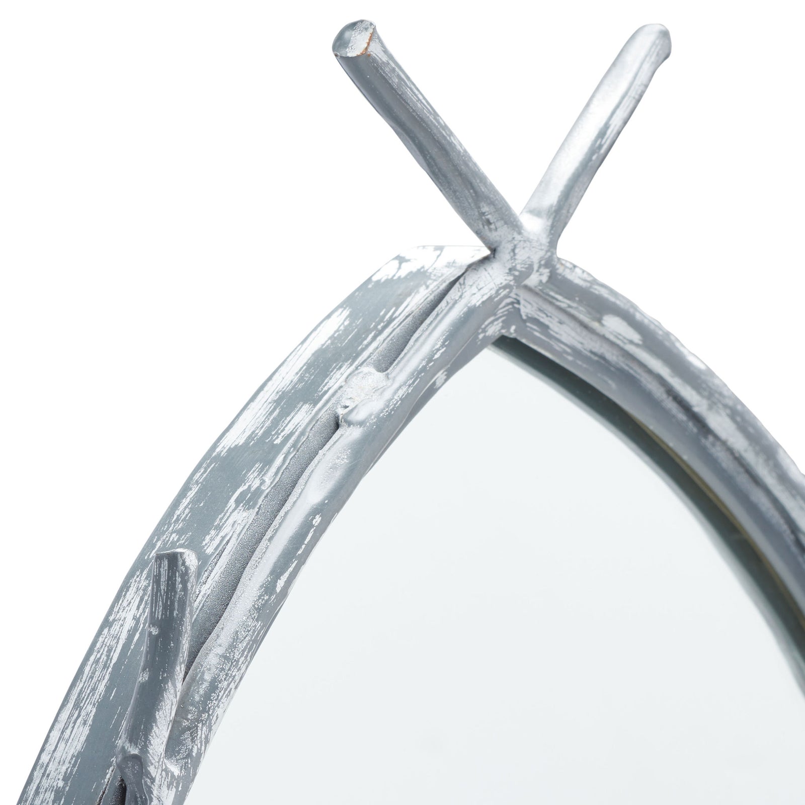 Crossed silver twigs and textured detailing give the mirror frame an organic feel. || MRR3043A || detail_studio