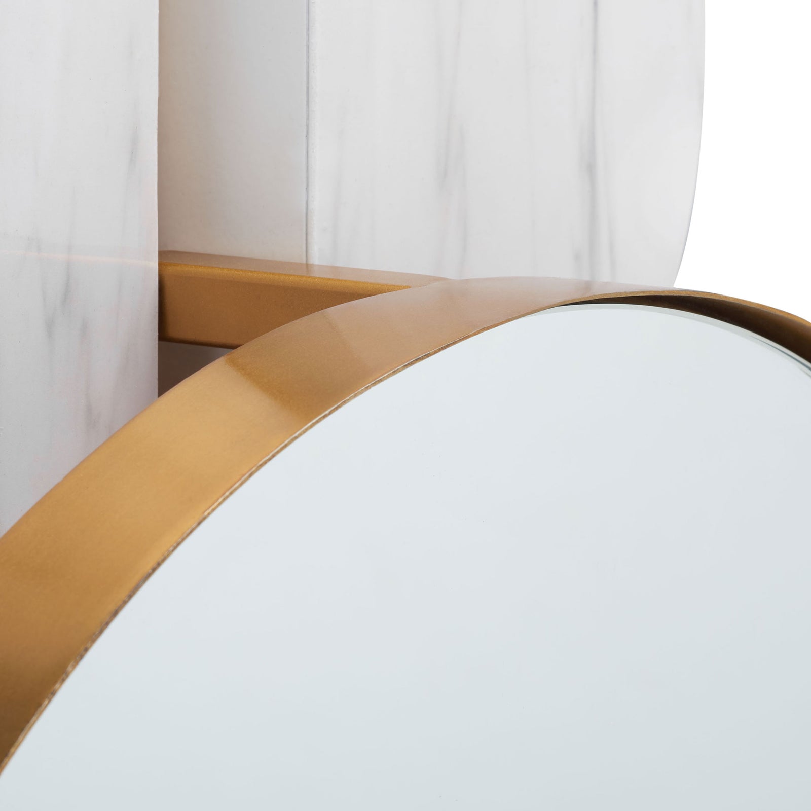 A smooth gold rim meets the mirror's edge against a white marble-look backing || MRR3048A || detail_studio