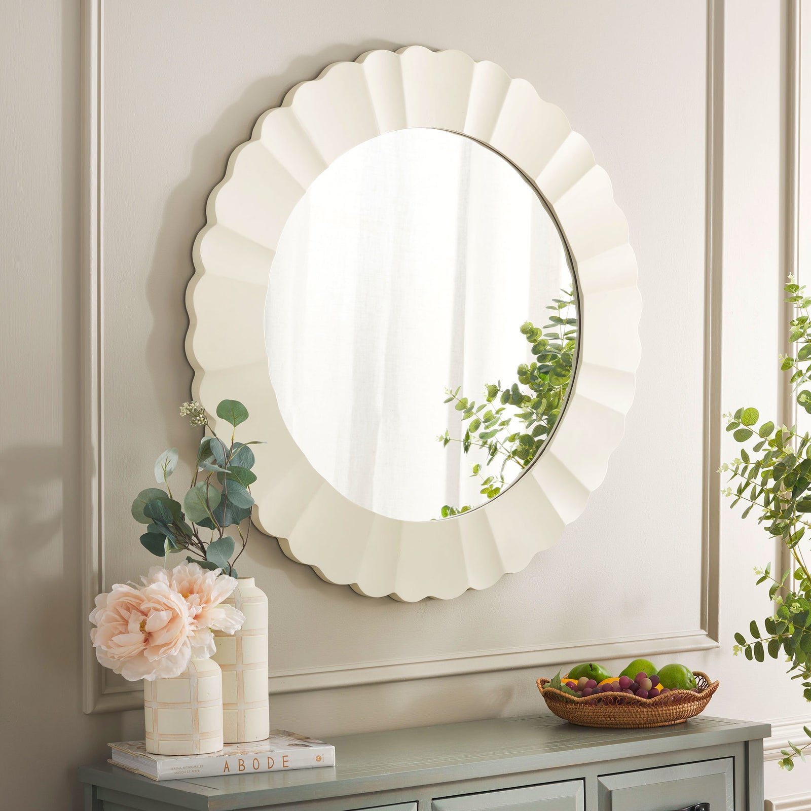 The white fluted mirror reflects greenery and brightens the wall above a console. || MRR9004A || front_room