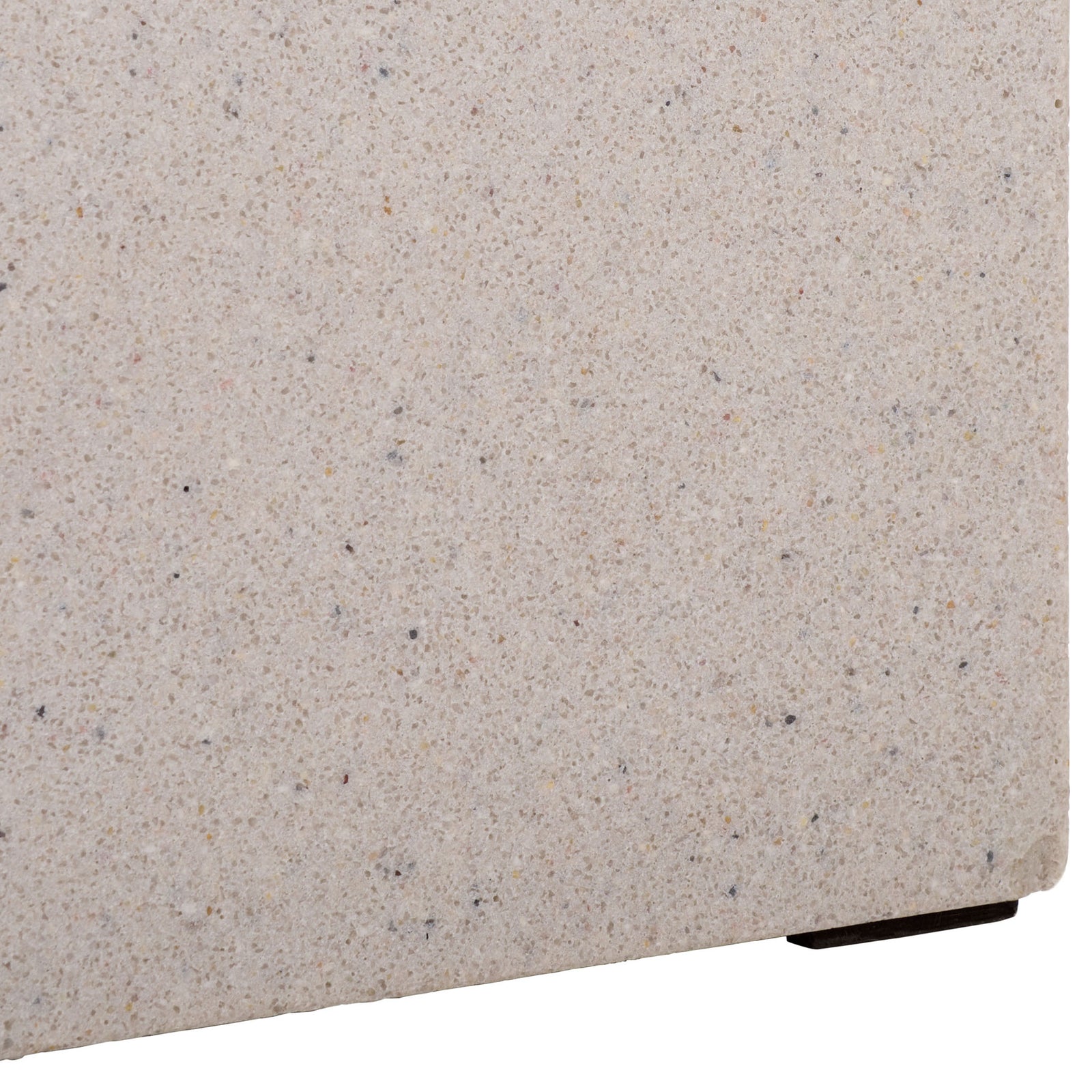 A discreet dark foot raises the speckled beige base slightly above the ground || PAT1403B || leg_studio