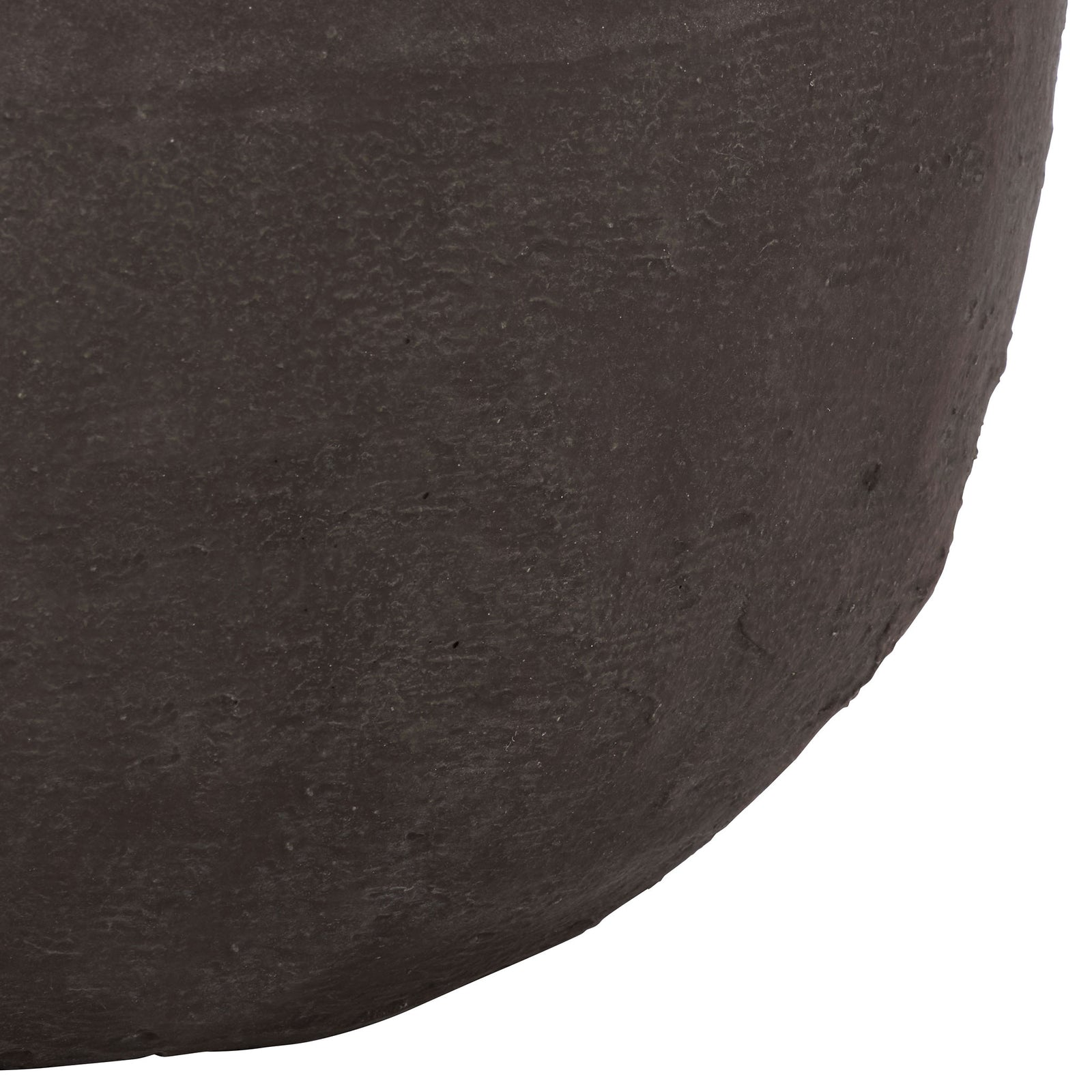 The rounded base of the large brown planter reveals softly mottled texture. || PAT1405A || leg_studio