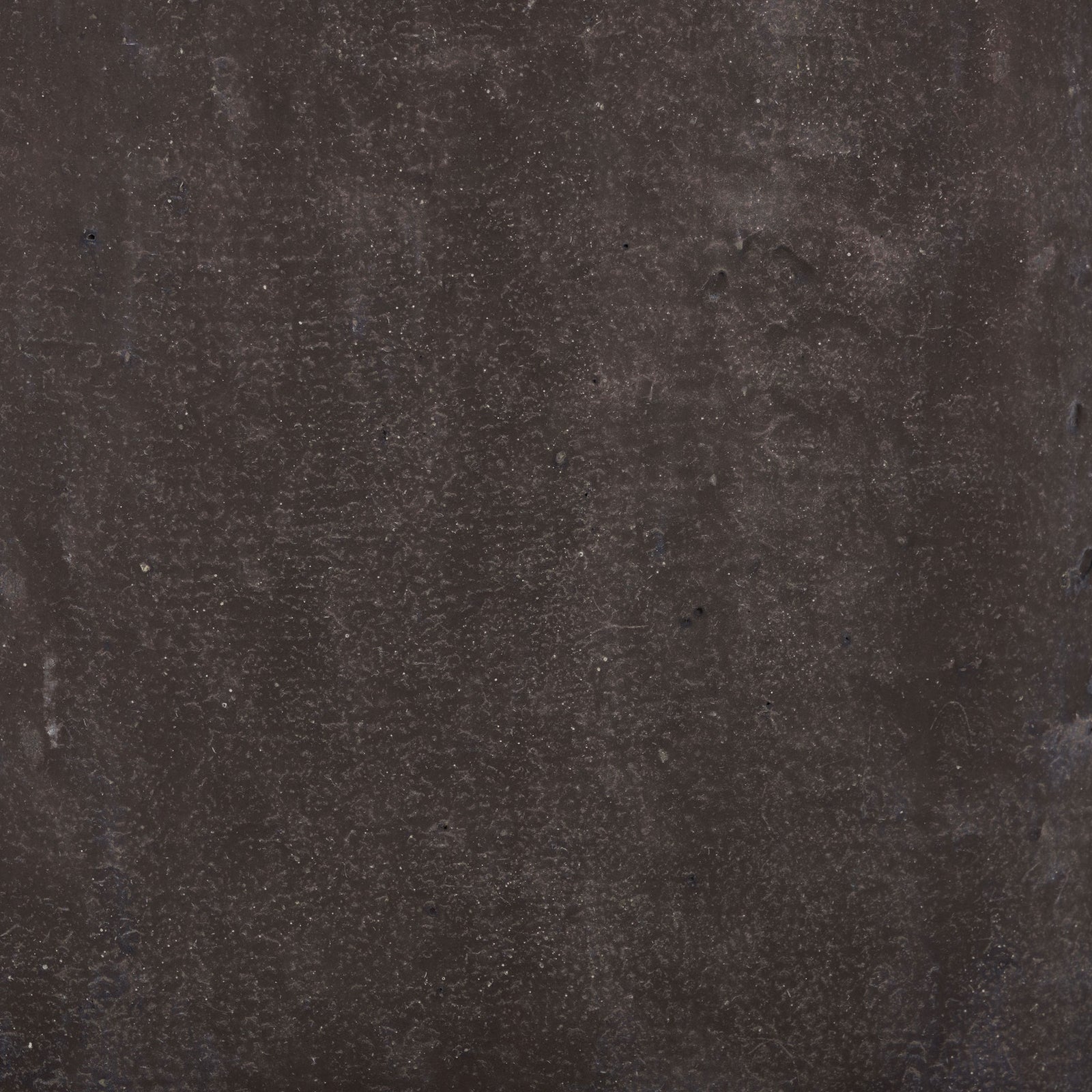 Brown surface displays subtle speckling and a matte, stone-like texture. || PAT1408A || swatch_studio
