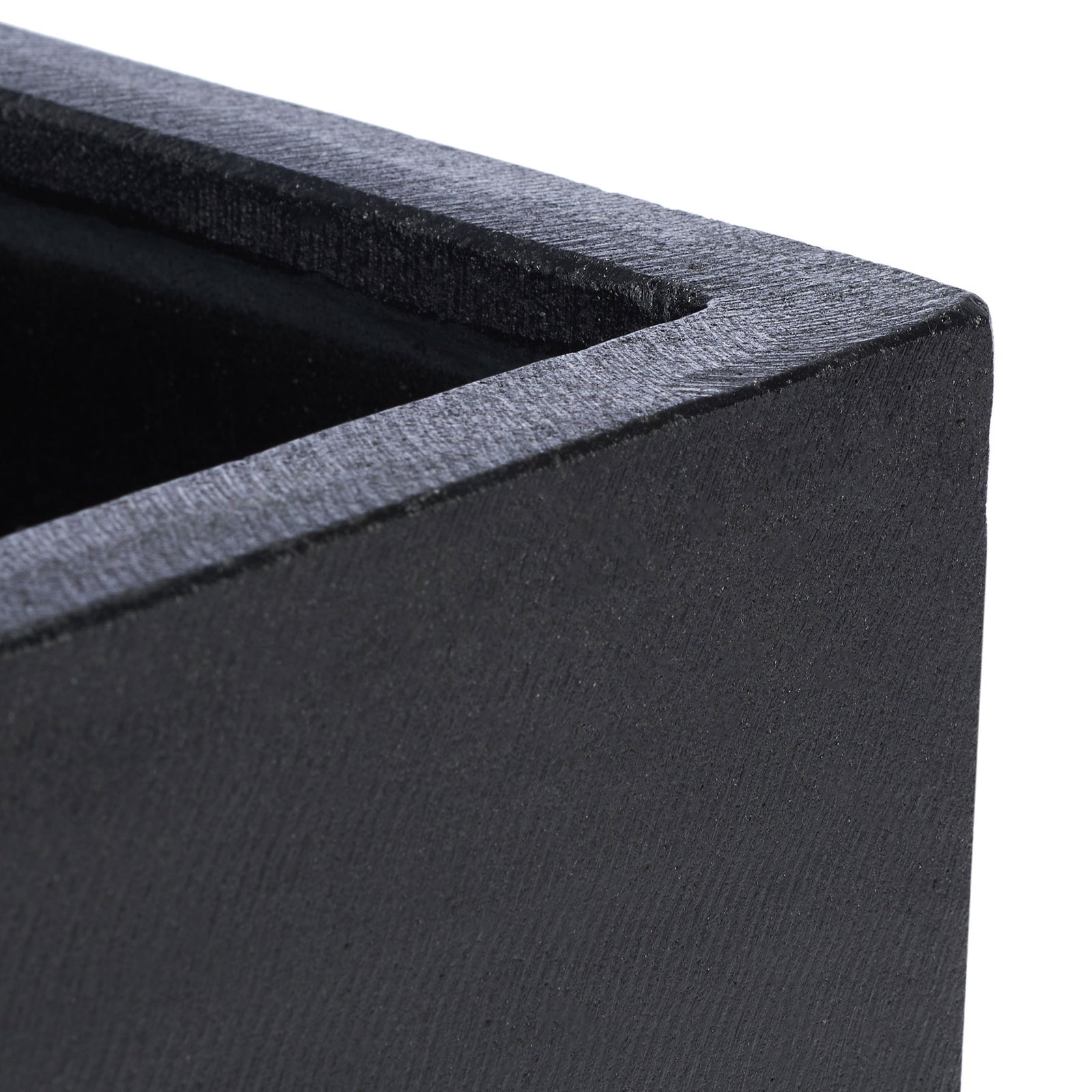 Textured black concrete and a substantial square rim give the planter a crisp, sculptural edge. || PAT1512A || detail_studio